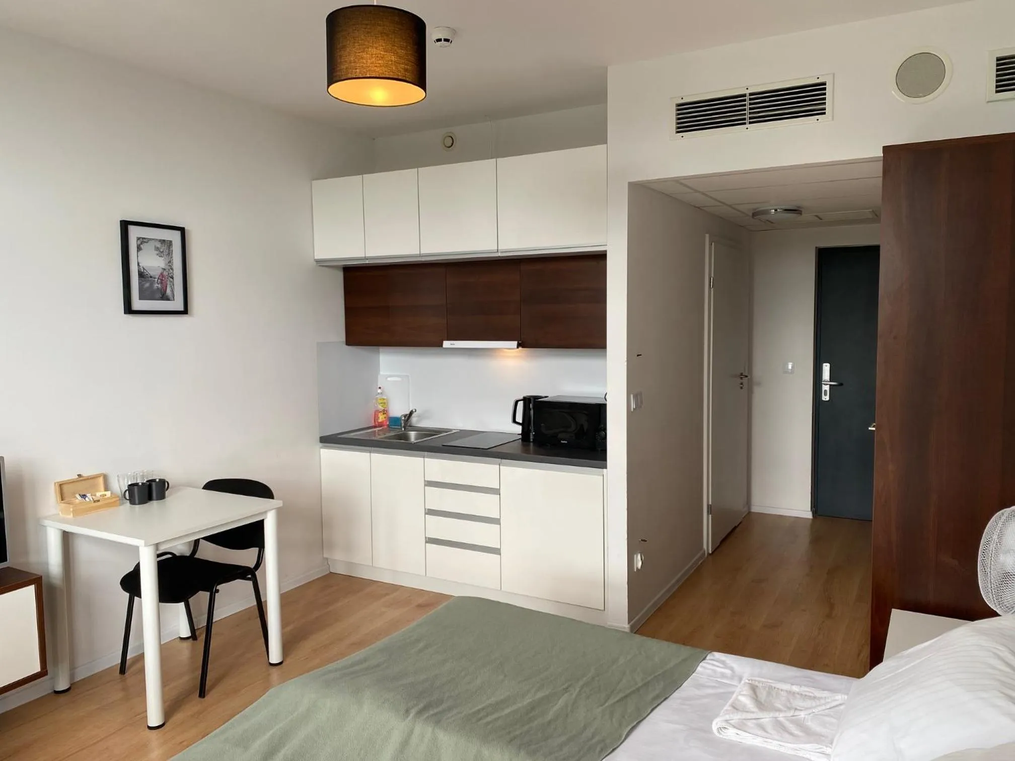 Bed in SleepWell Apartments