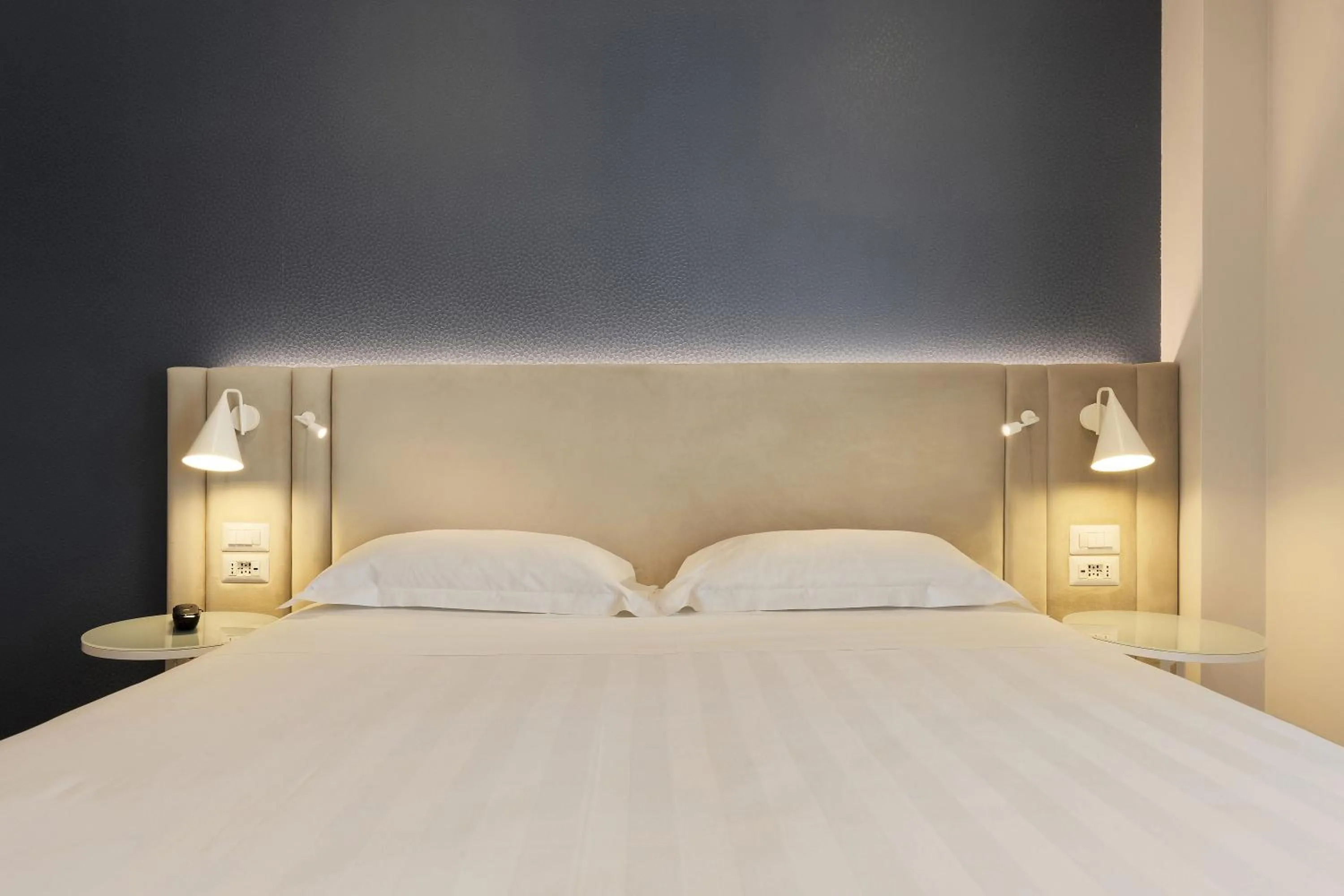 Bed in Adesso Hotel