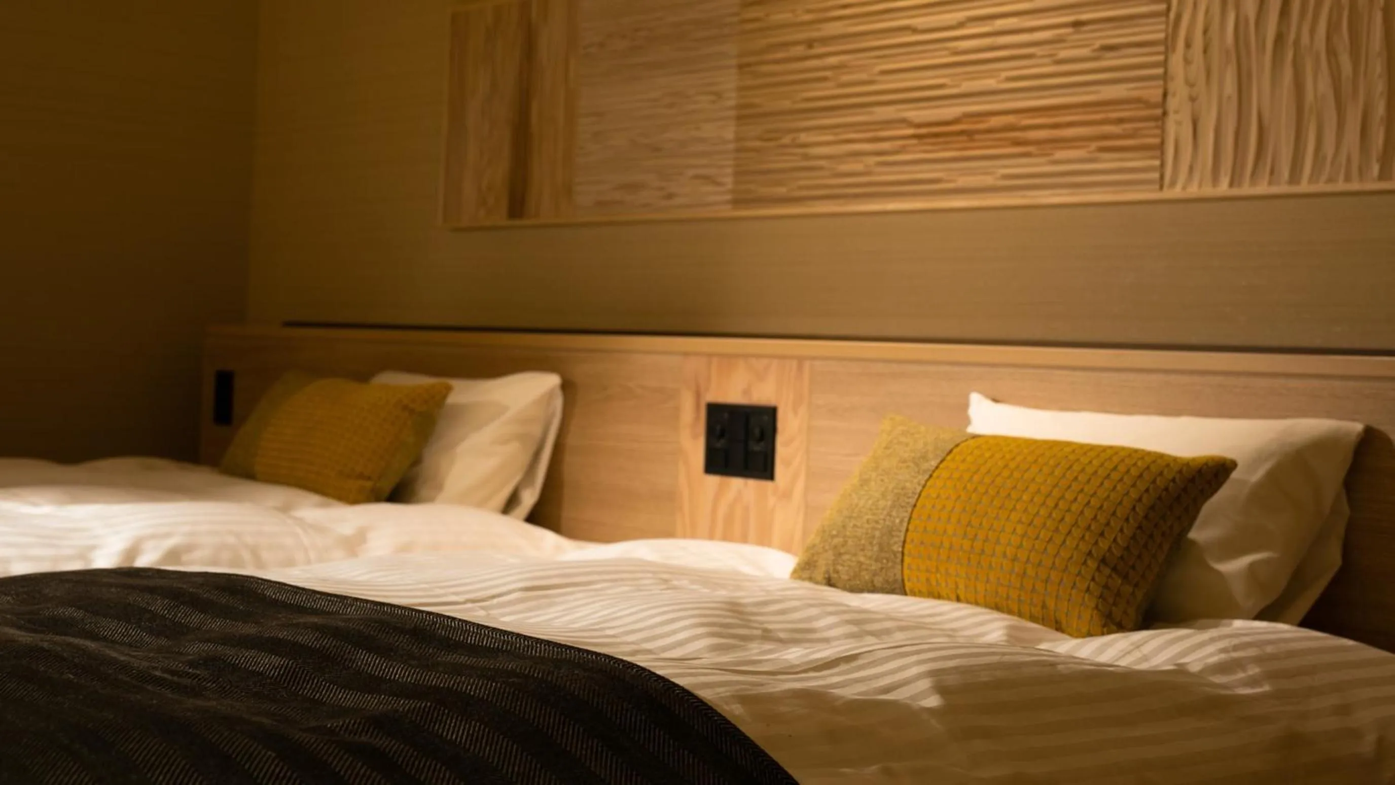 Bed in Kyukamura Retreat-Azumino-Hotel