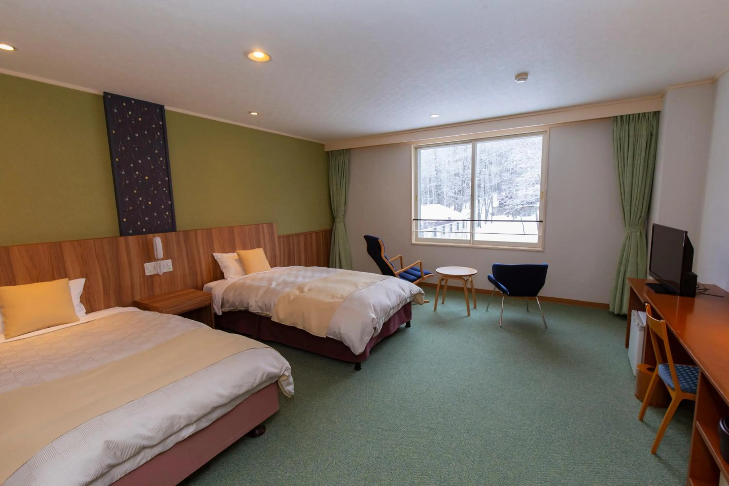 Bed in Kyukamura Nyuto-Onsenkyo