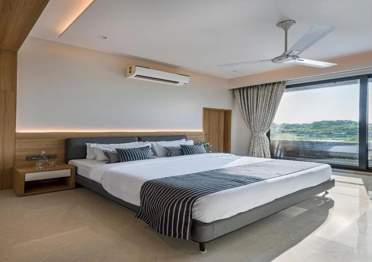 Bed in SaffronStays Nishta - 4BR pet-friendly villa with pool, turf, gazebo & terrace BBQ views in Alibaug