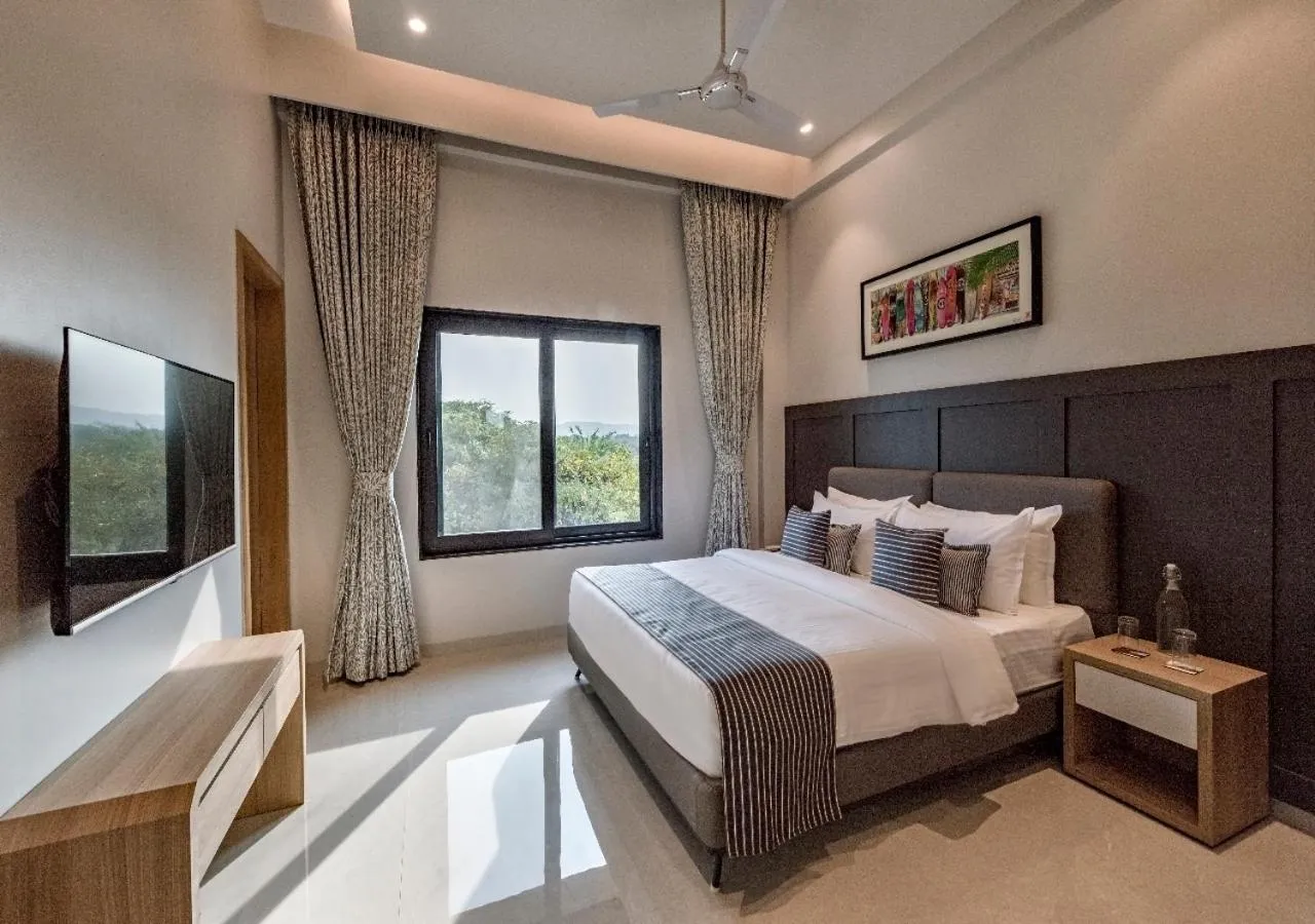 Bed in SaffronStays Nishta - 4BR pet-friendly villa with pool, turf, gazebo & terrace BBQ views in Alibaug