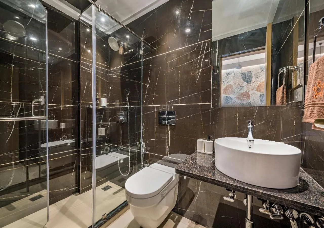 Shower in SaffronStays Nishta - 4BR pet-friendly villa with pool, turf, gazebo & terrace BBQ views in Alibaug