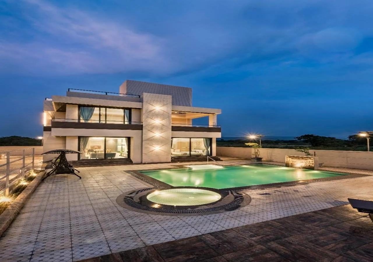 Property building in SaffronStays Nishta - 4BR pet-friendly villa with pool, turf, gazebo & terrace BBQ views in Alibaug