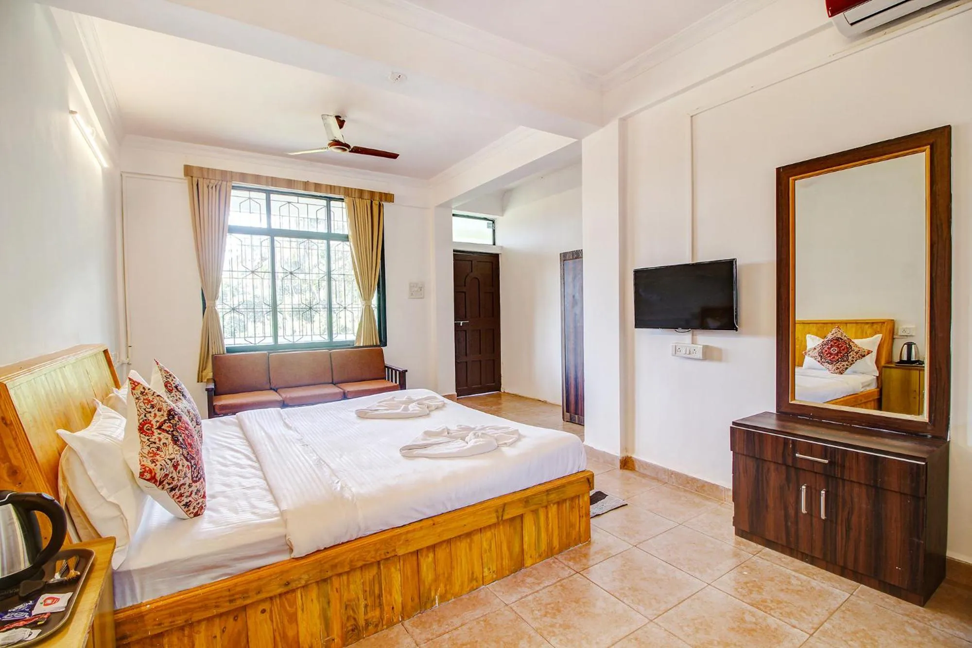 Bed in FabHotel Pleasure Inn