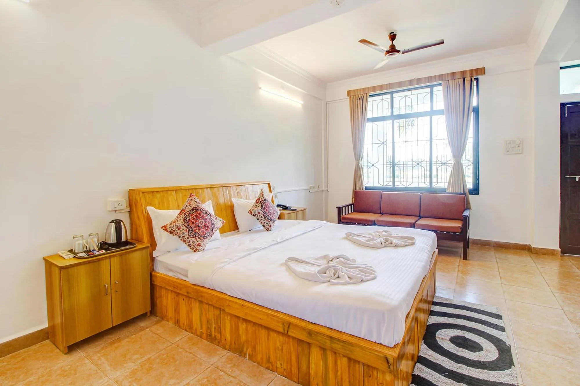 Bed in FabHotel Pleasure Inn