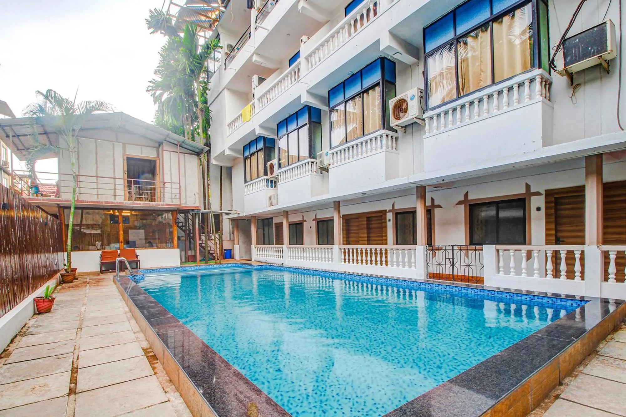 Property building, Swimming Pool in FabHotel Pleasure Inn
