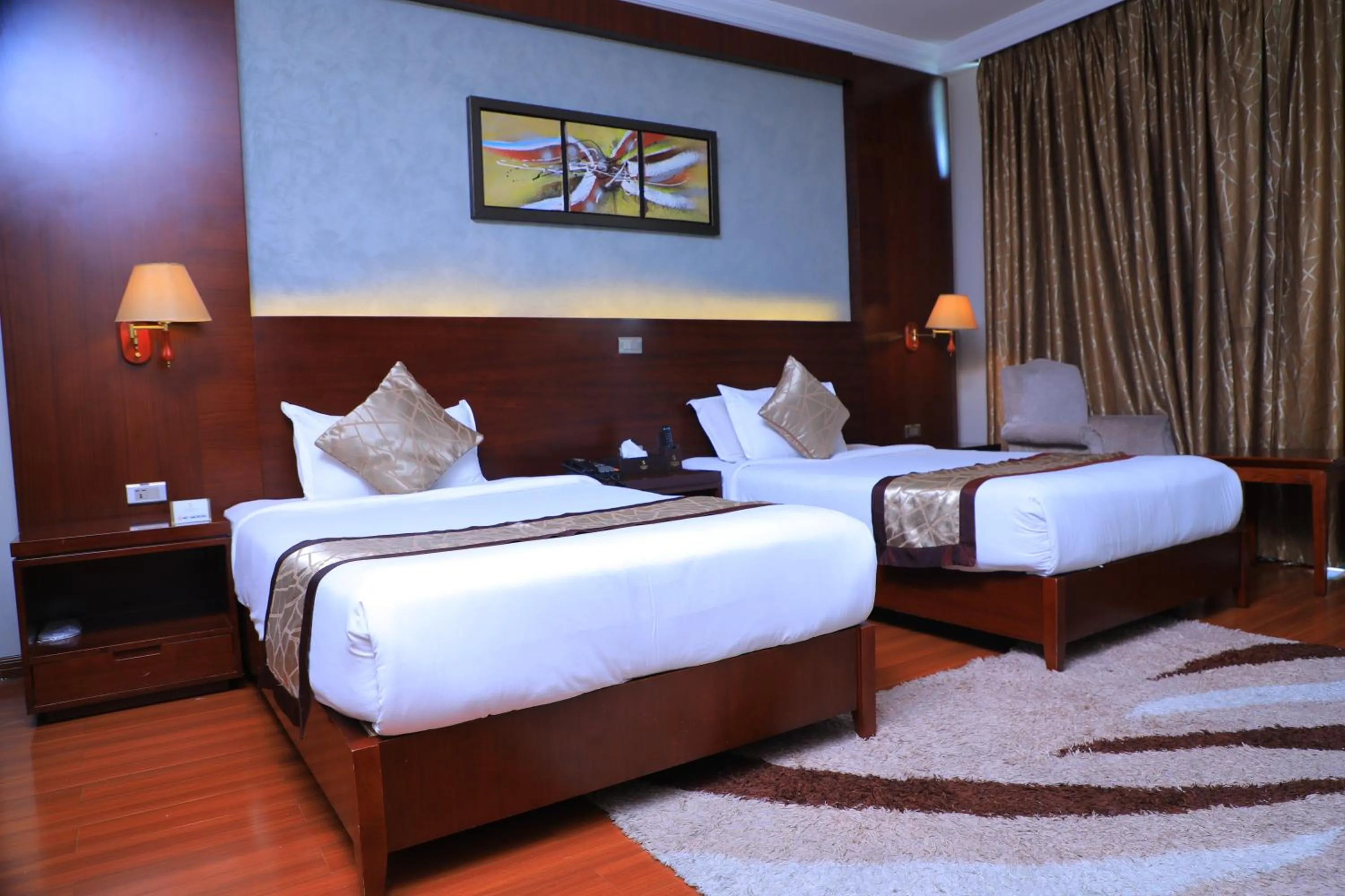 Bed in Sidra International Hotel