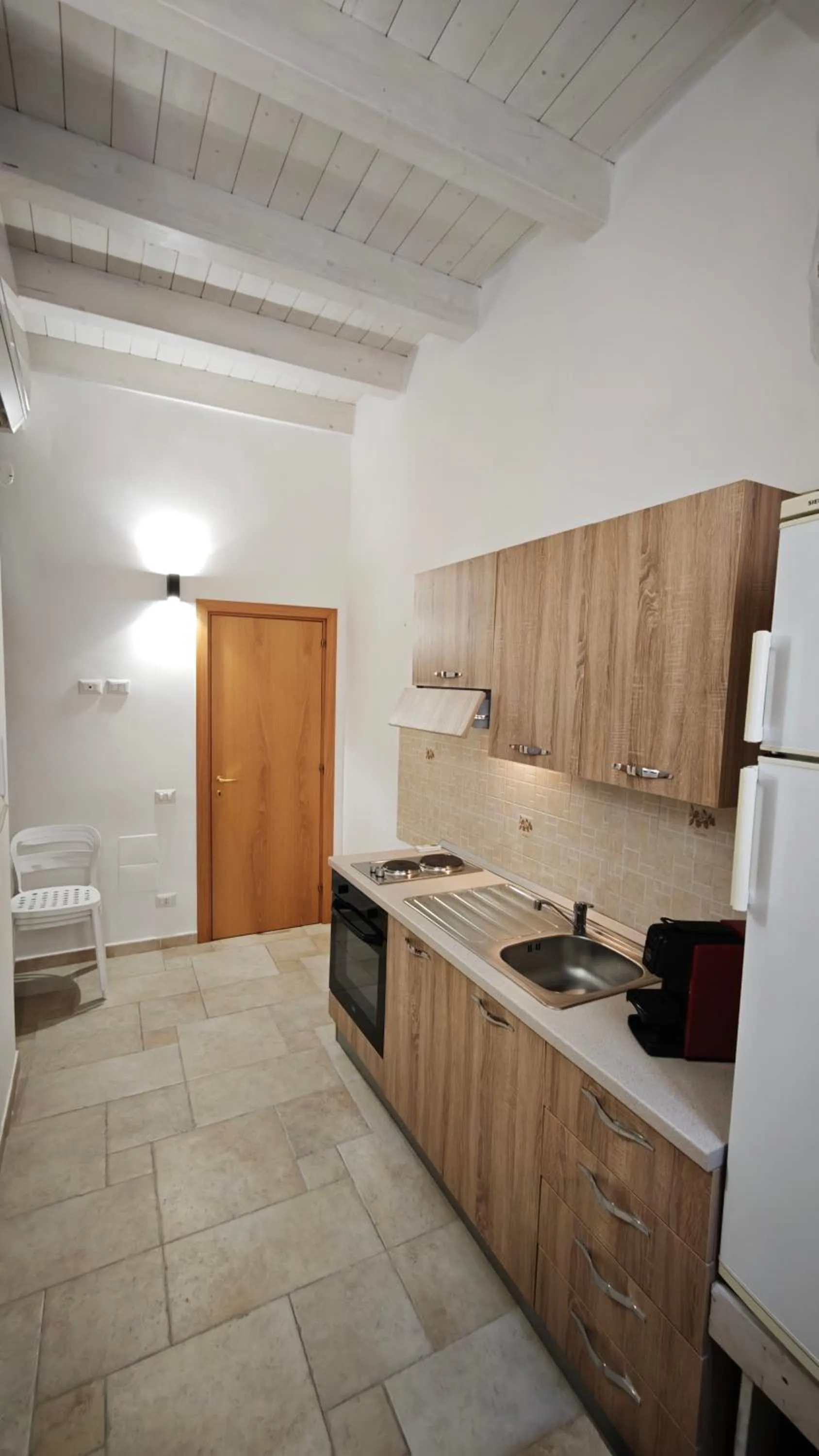Kitchen or kitchenette in ''B&B Santa Rita Corato fitta camere''