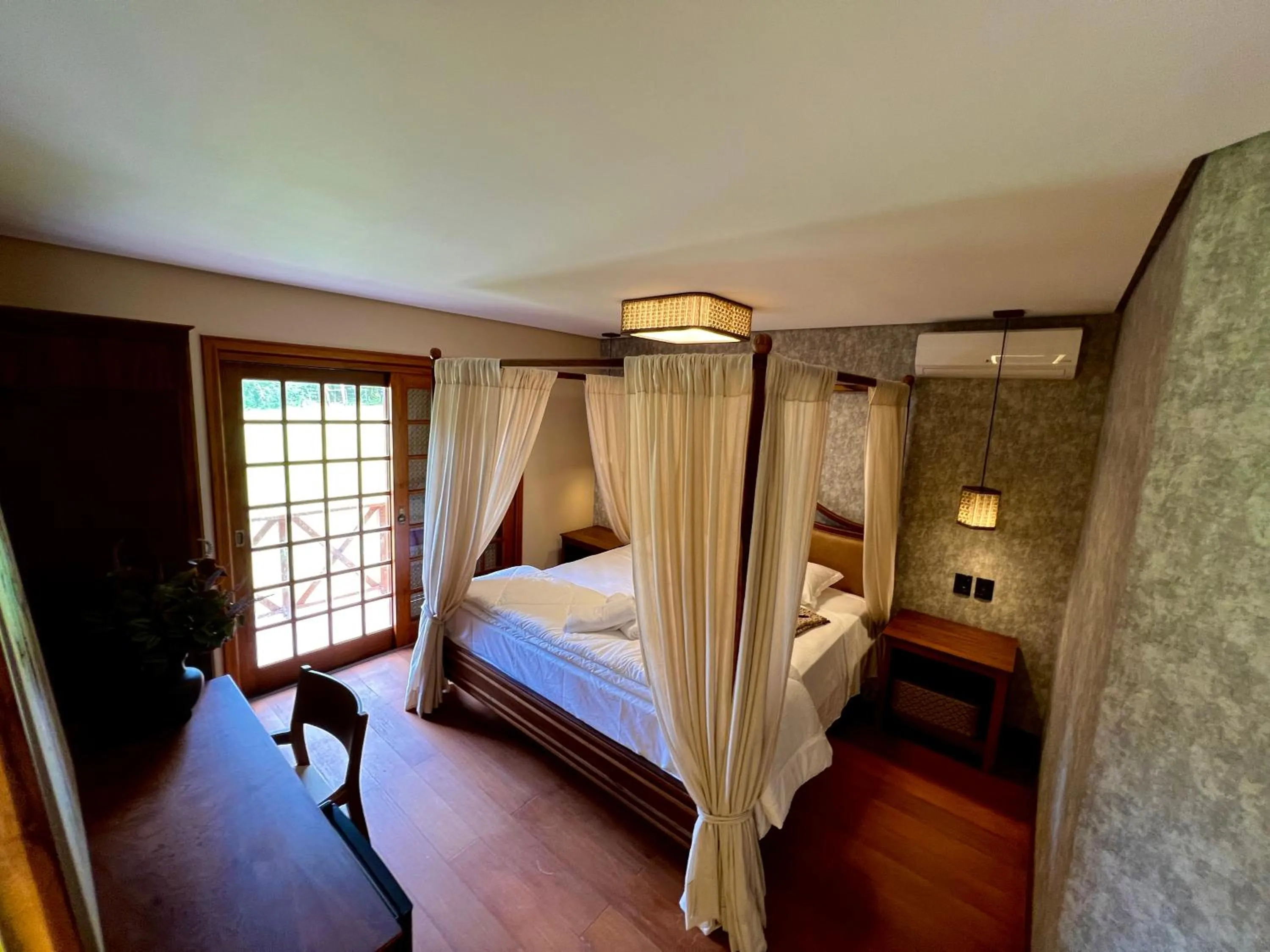 Bed in WoodStone Hotel Fazenda