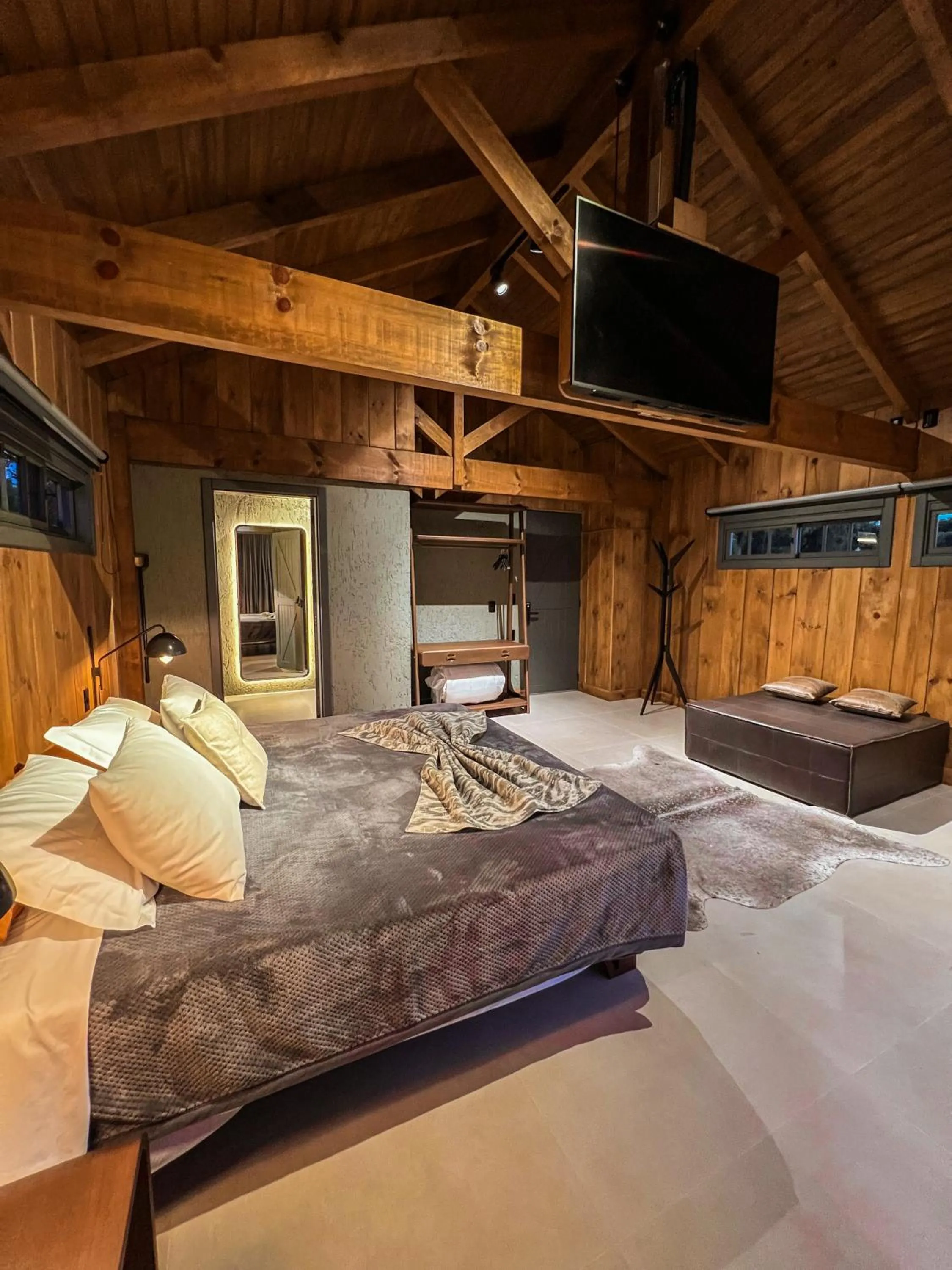 Bed in WoodStone Hotel Fazenda