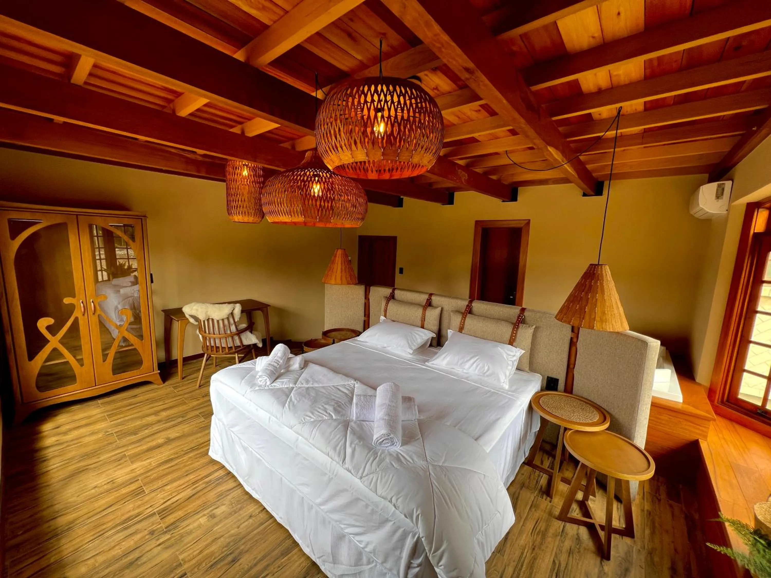 Bed in WoodStone Hotel Fazenda