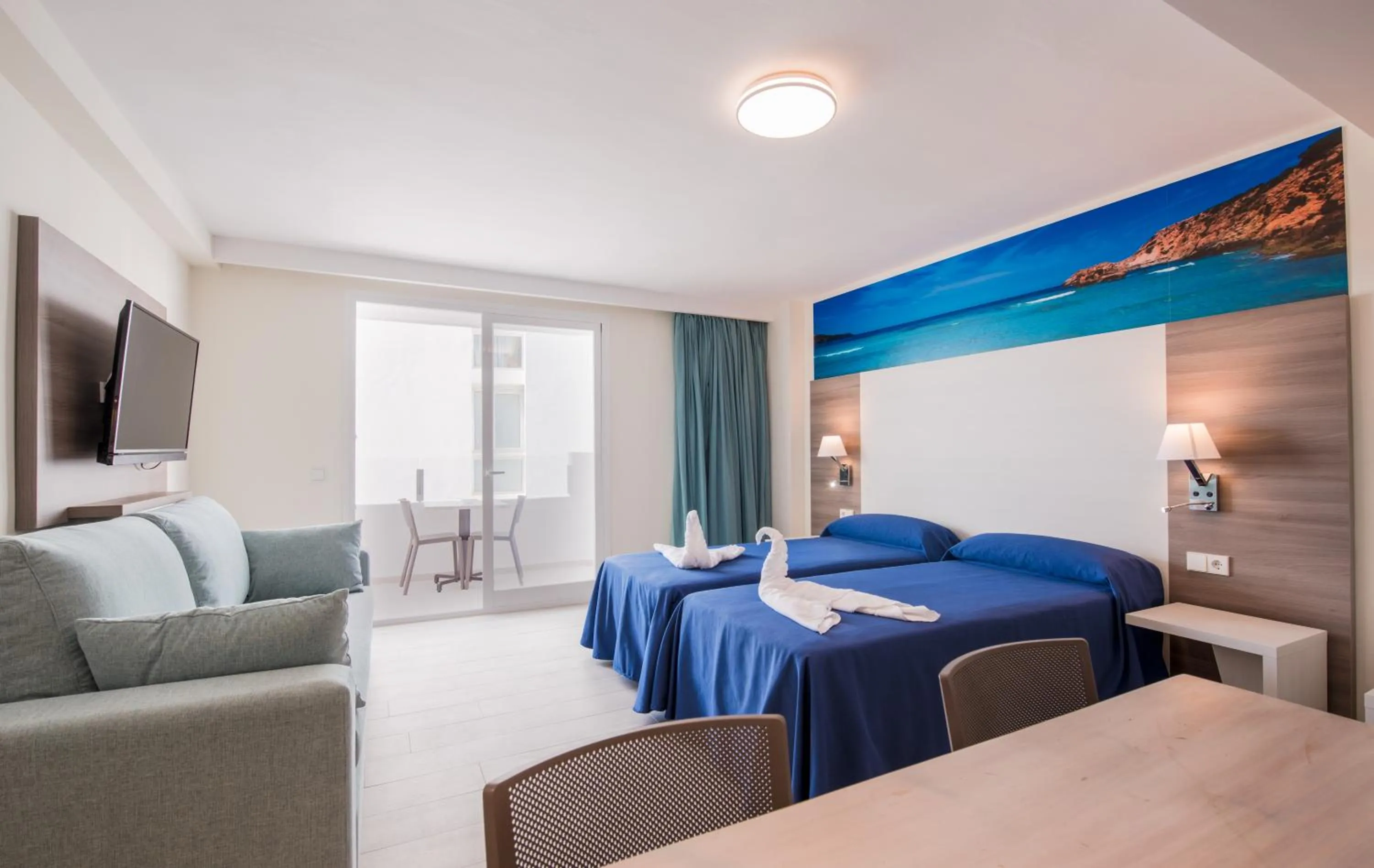 Seating area, Bed in Apartamentos Los Angeles