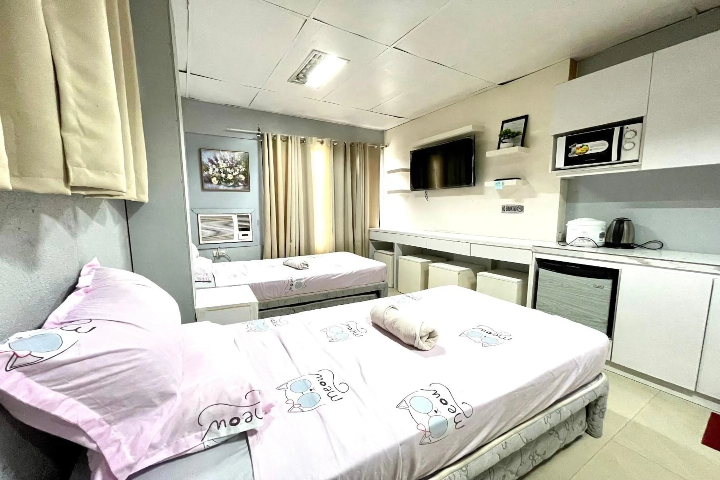 Bedroom in OYO 910 Sabaidee Suites