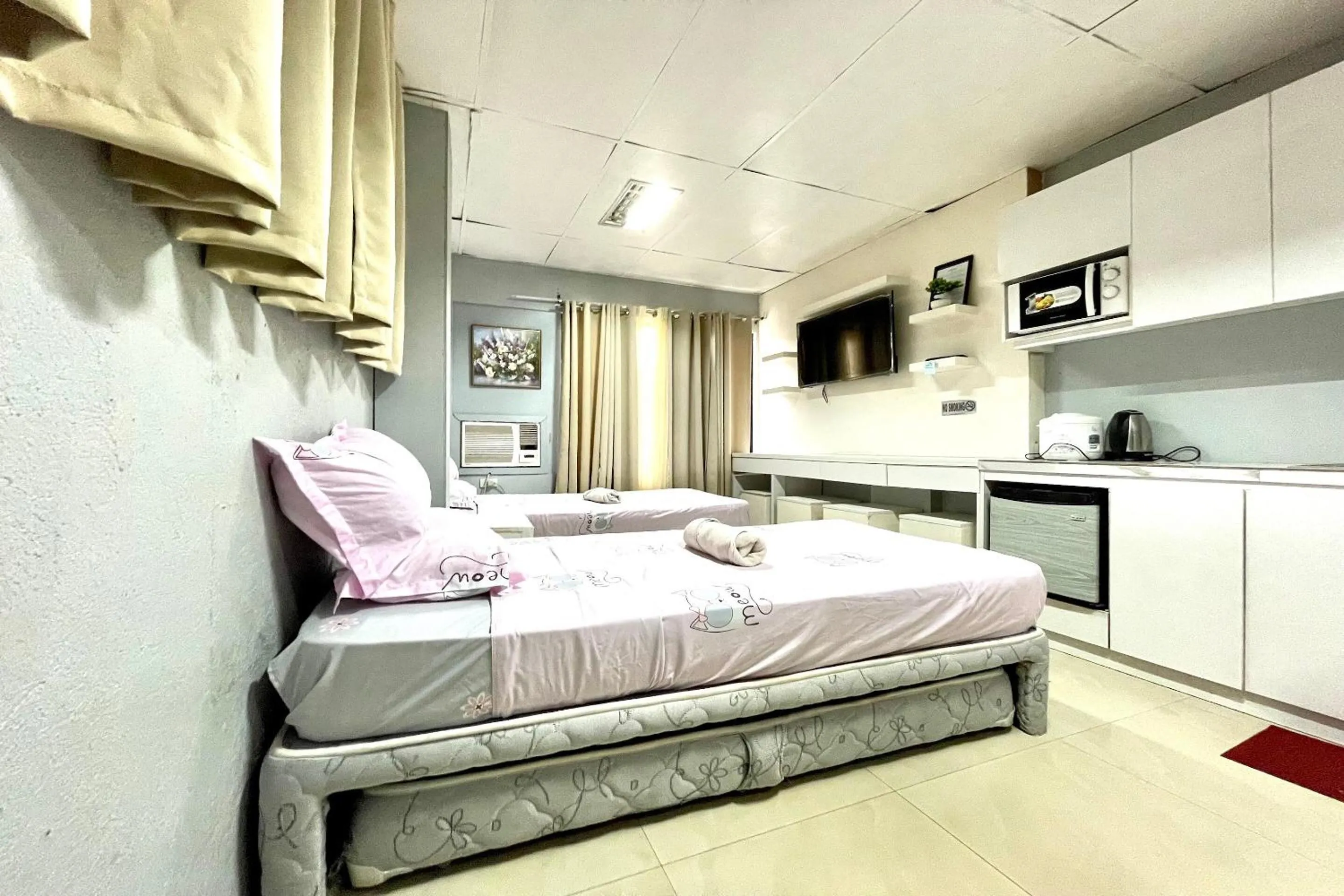 Bedroom in OYO 910 Sabaidee Suites