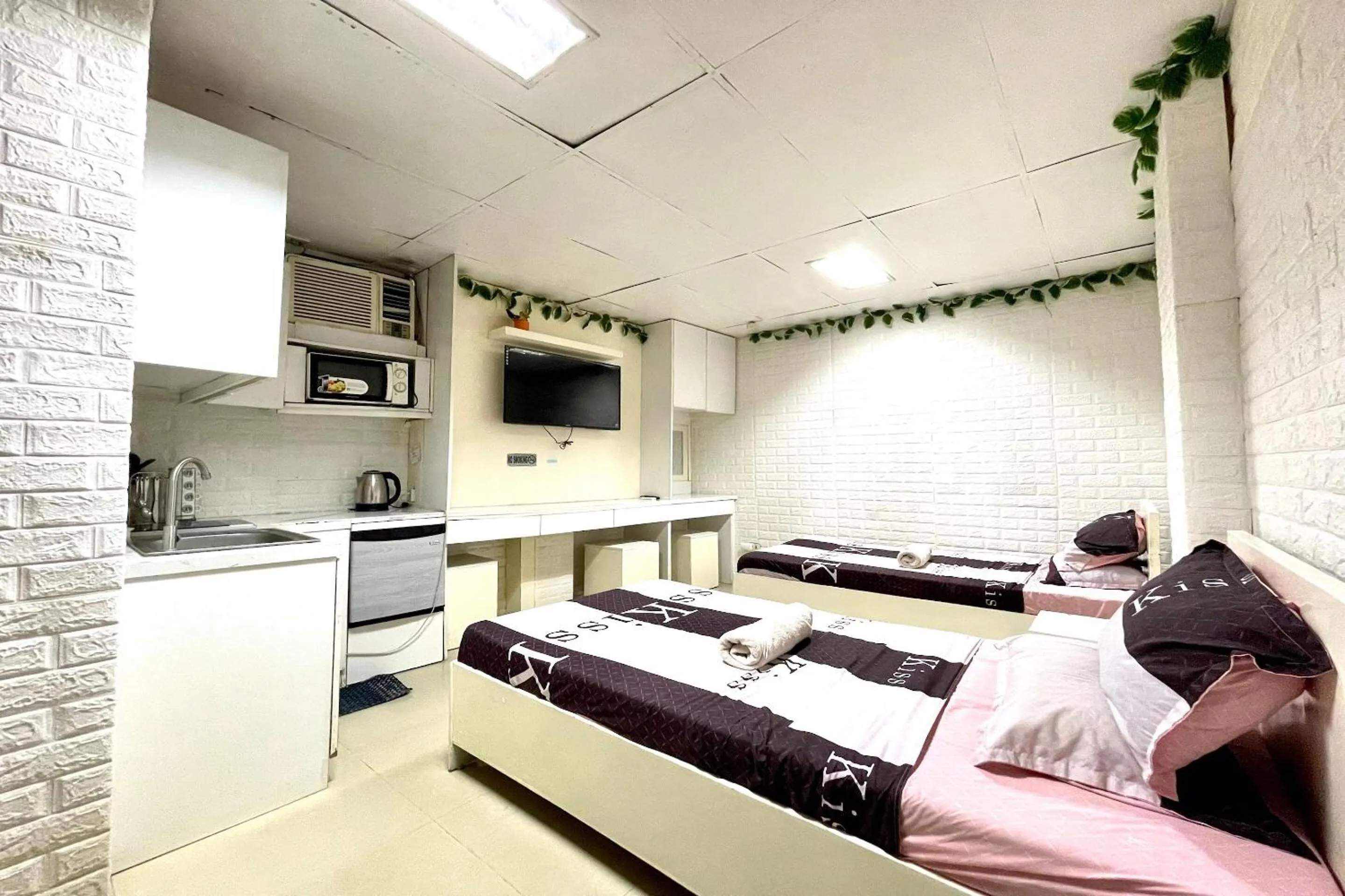 Bedroom in OYO 910 Sabaidee Suites