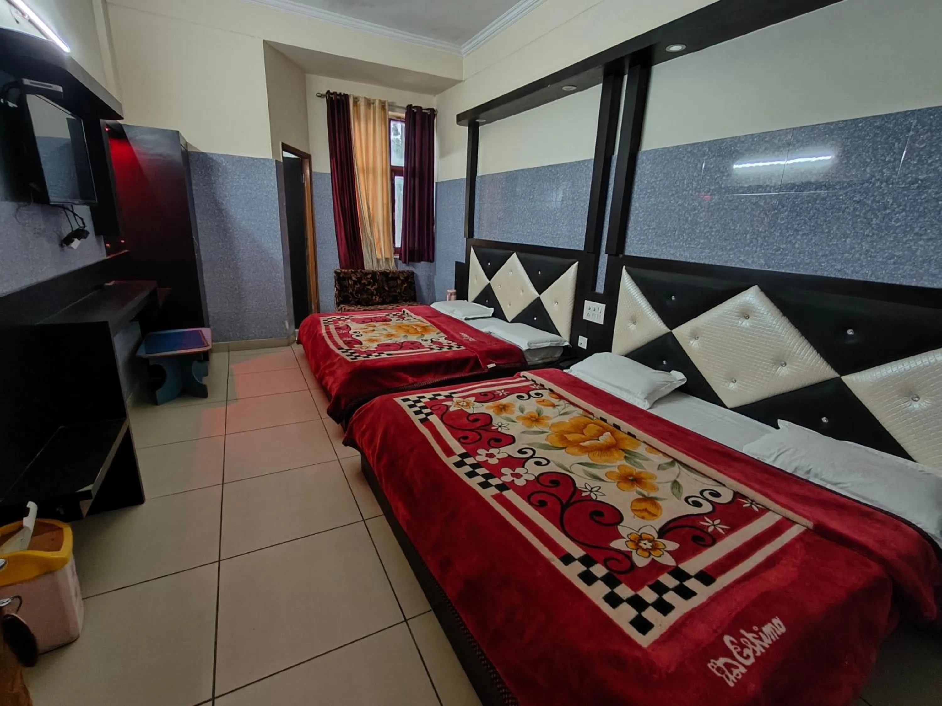 Bed in AASHIRWAD HOTEL