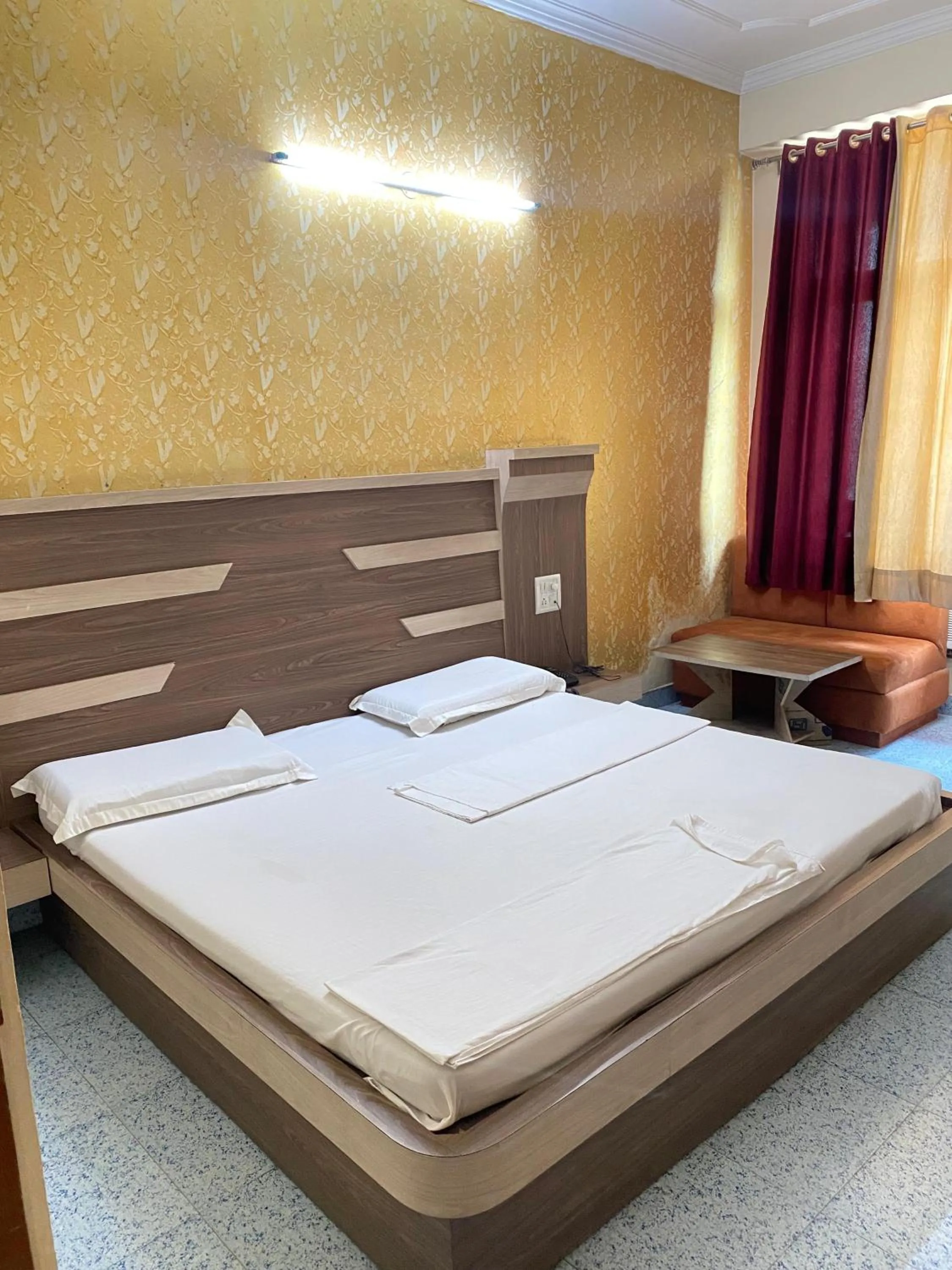 Bed in AASHIRWAD HOTEL