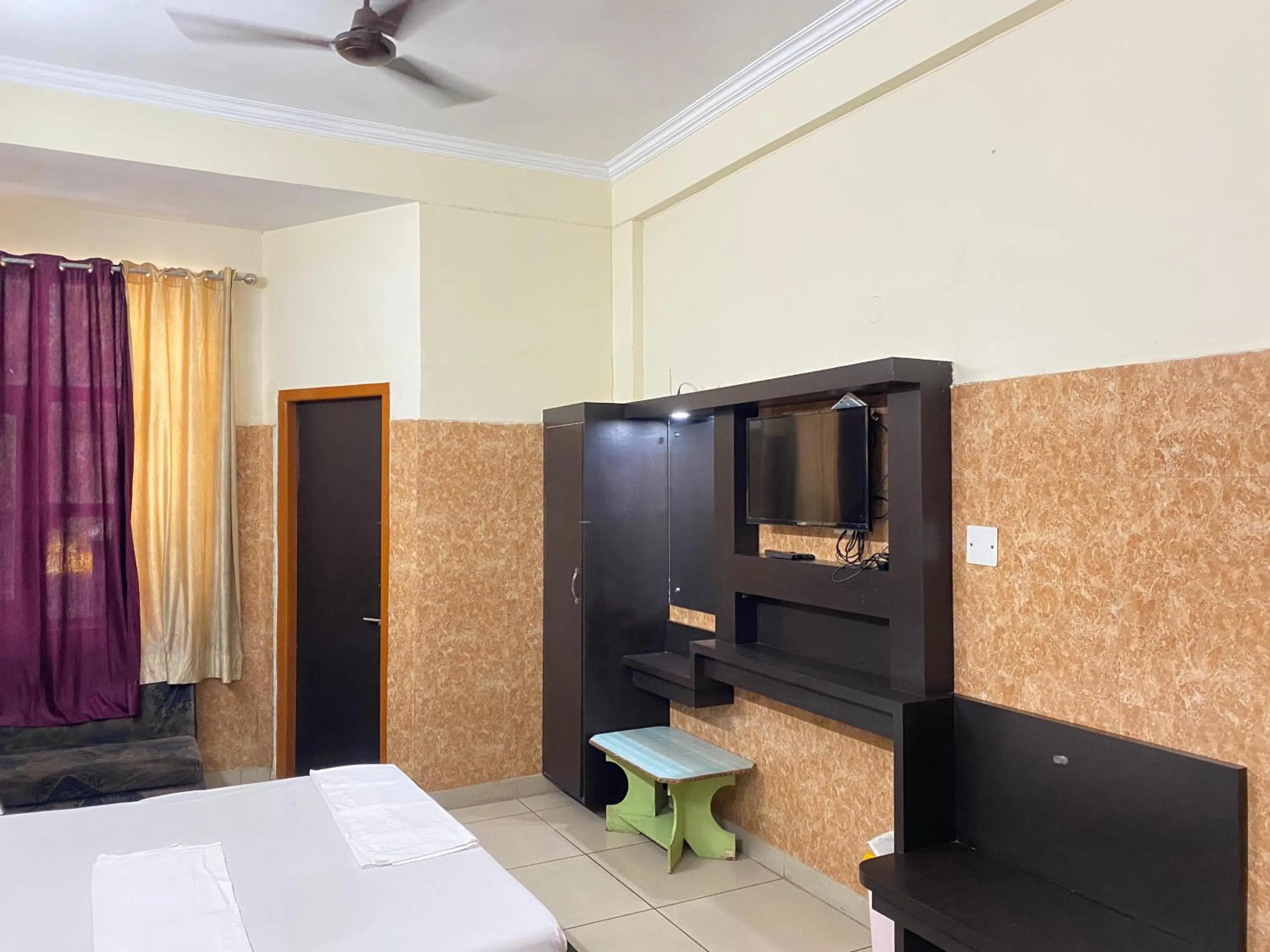 Bed in AASHIRWAD HOTEL