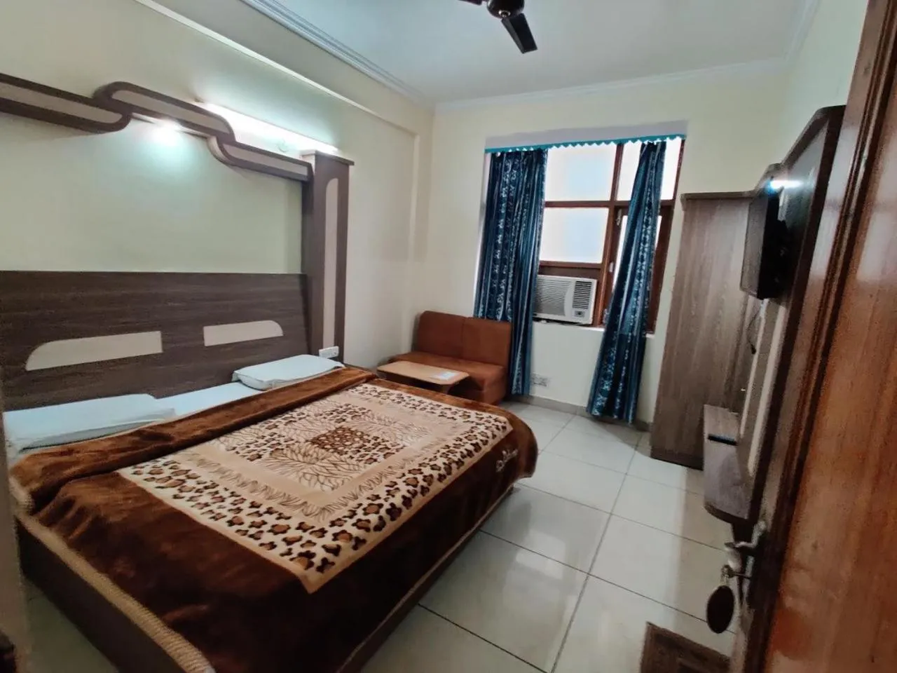 Bed in AASHIRWAD HOTEL