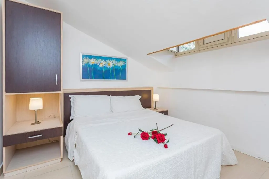 Bed in Sirina House Taormina