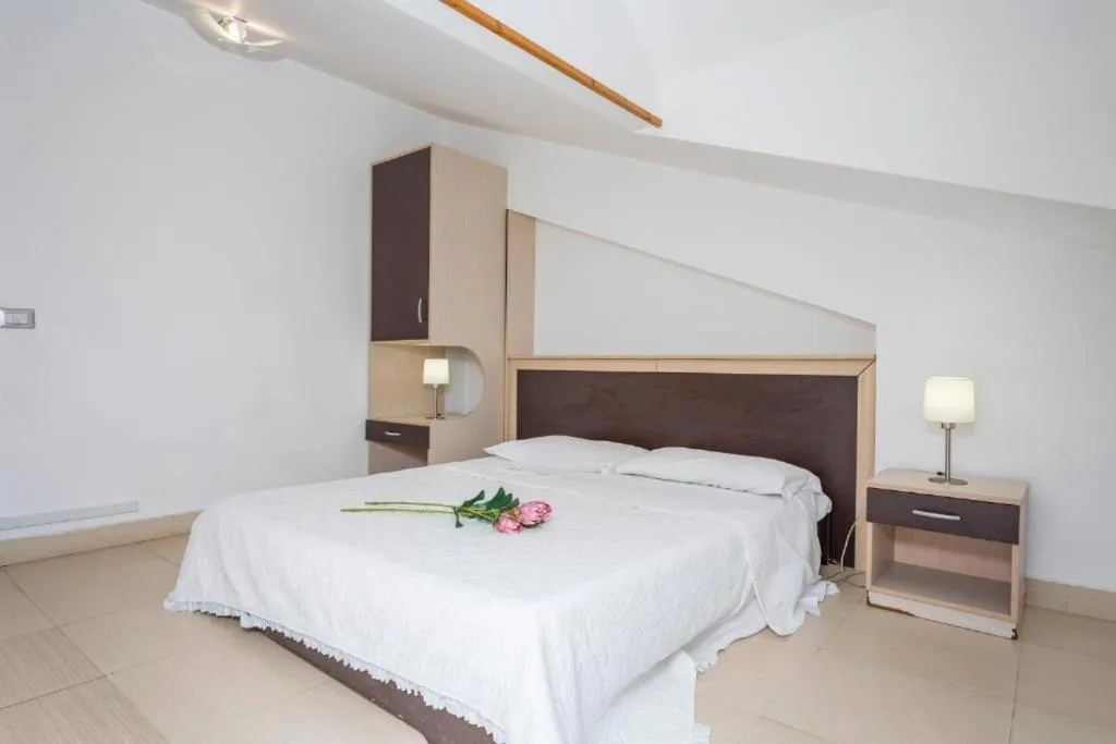 Bed in Sirina House Taormina