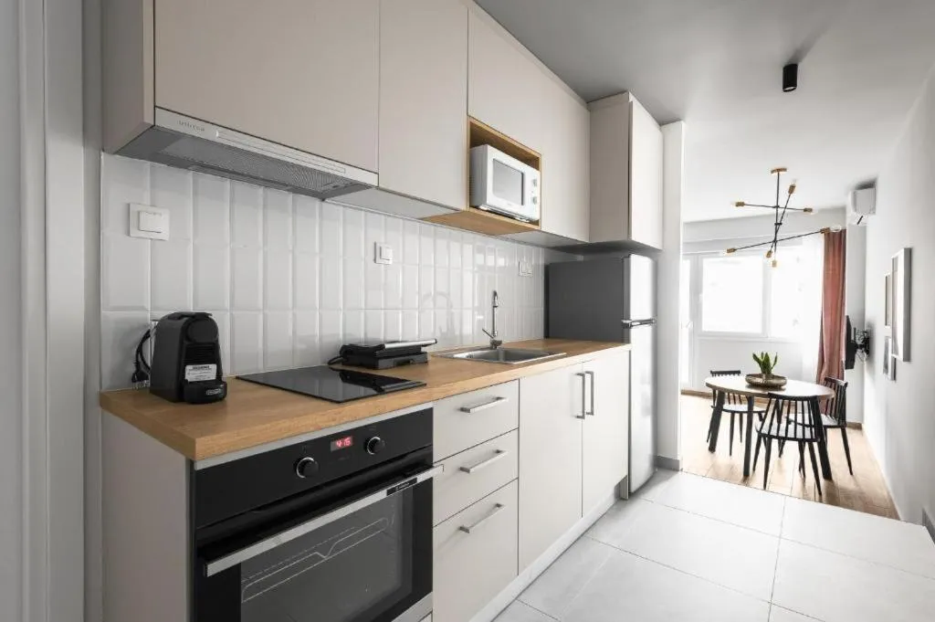 Kitchen or kitchenette in Big Apple, Nilie Hospitality MGMT