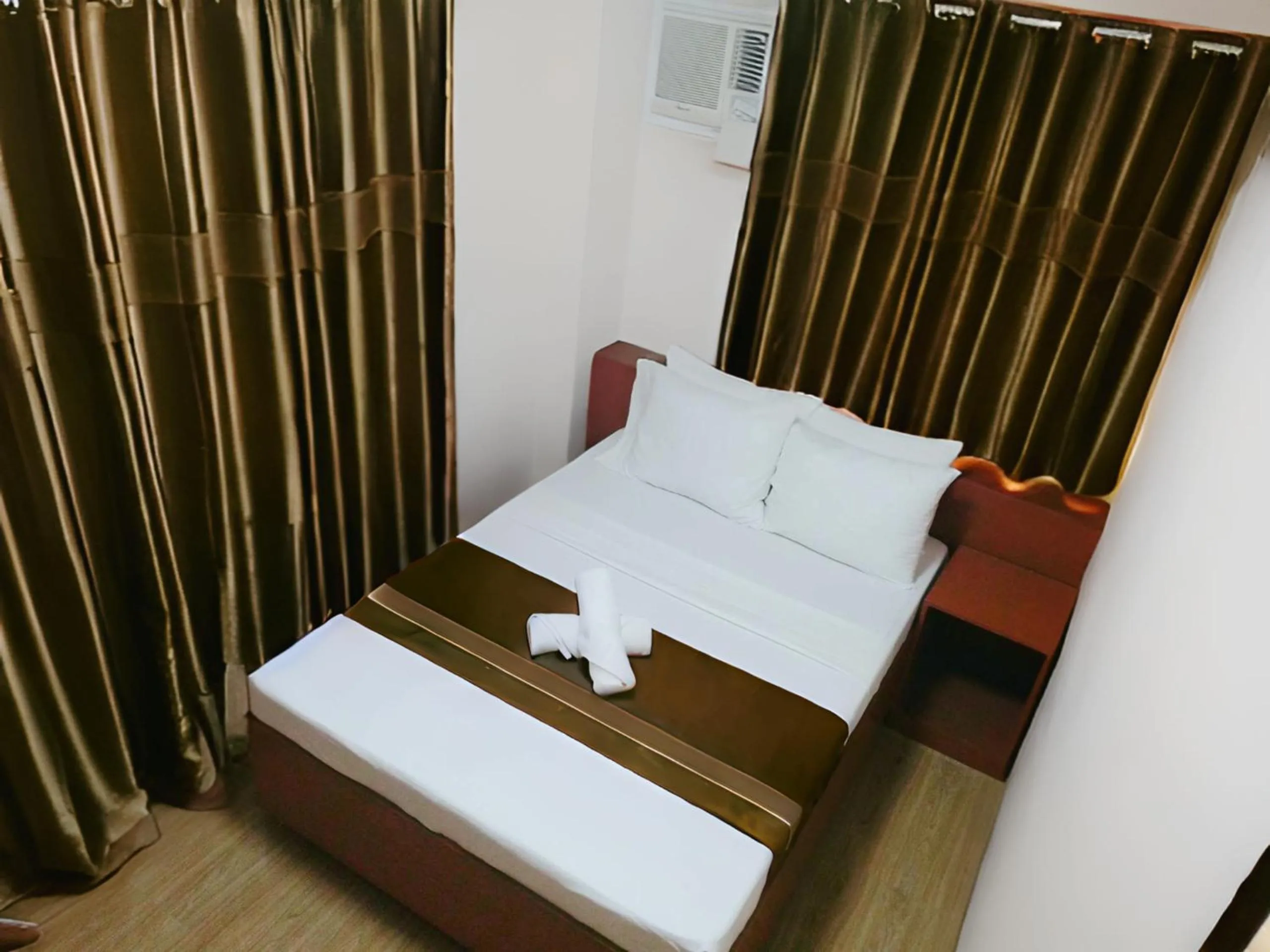 Bed in Dy Heritage Suites