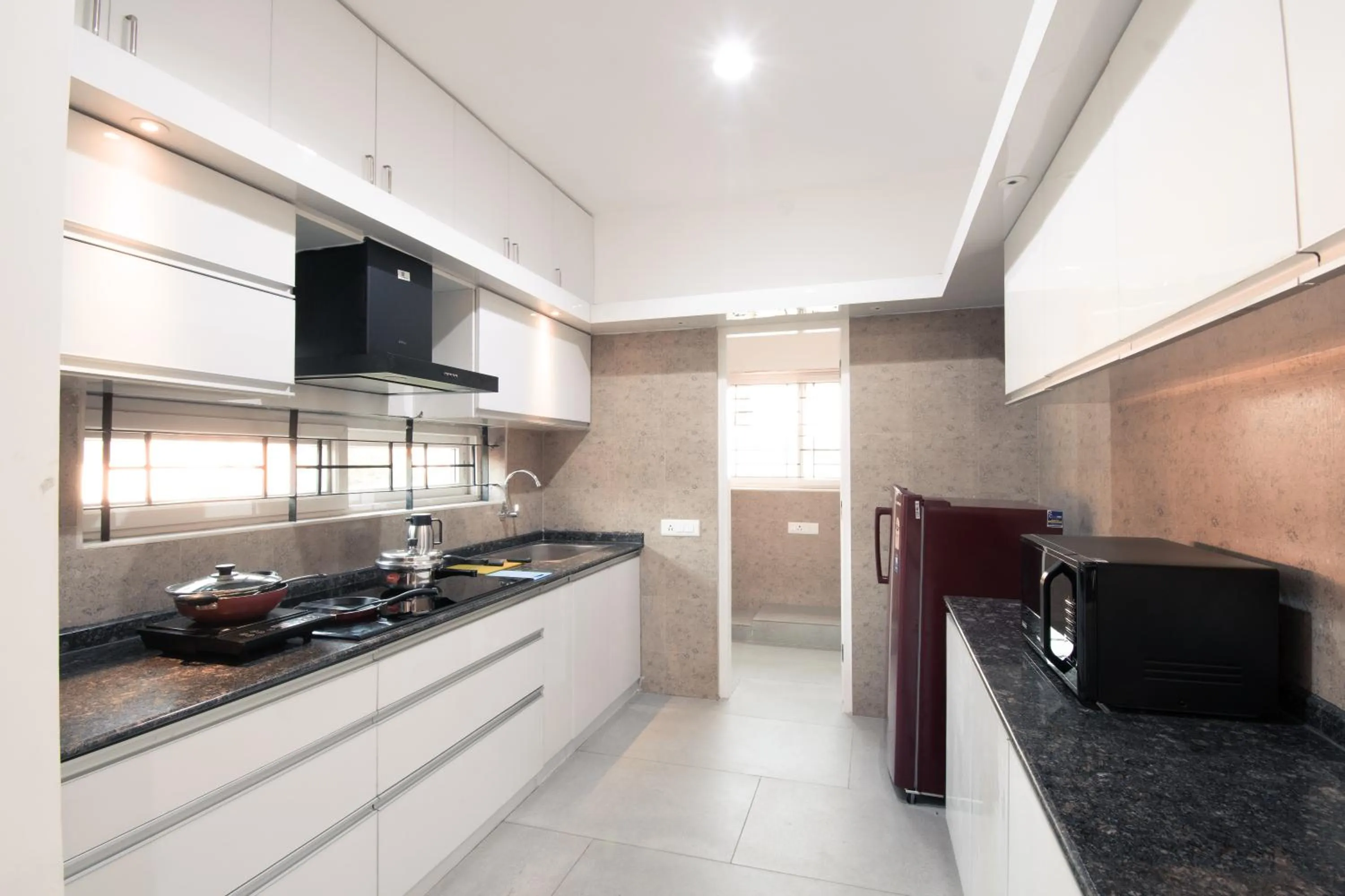Kitchen or kitchenette in Athulya Residence Suite Rooms