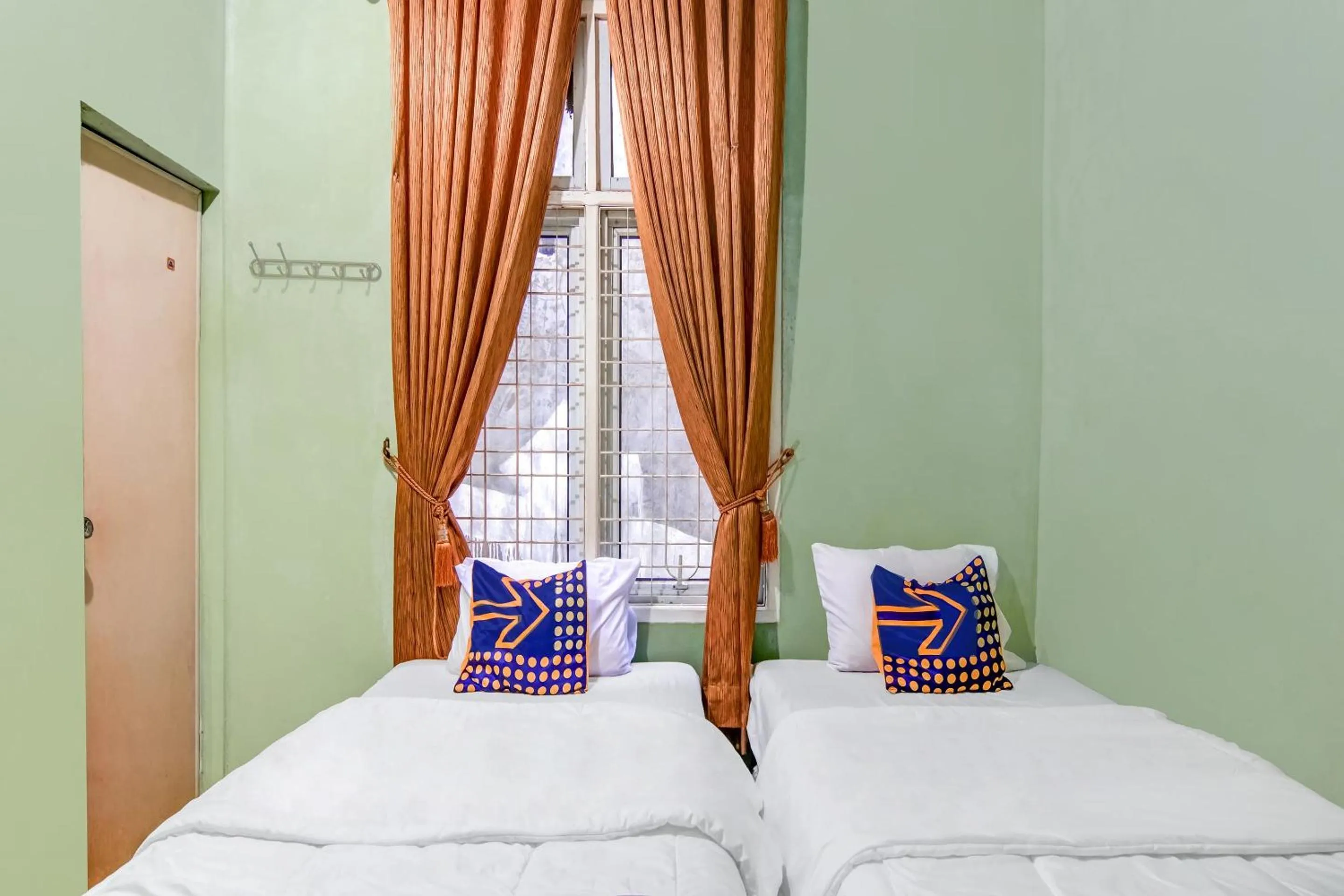 Bedroom in Hotel O Nayla Homestay Syariah Near Koro Koro Panam, Karaoke, Pool, & Cafe