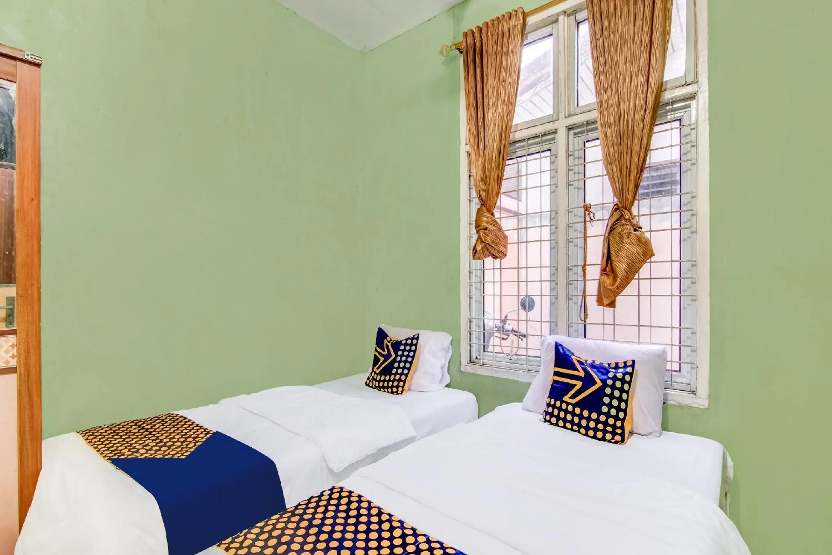 Bedroom in Hotel O Nayla Homestay Syariah Near Koro Koro Panam, Karaoke, Pool, & Cafe