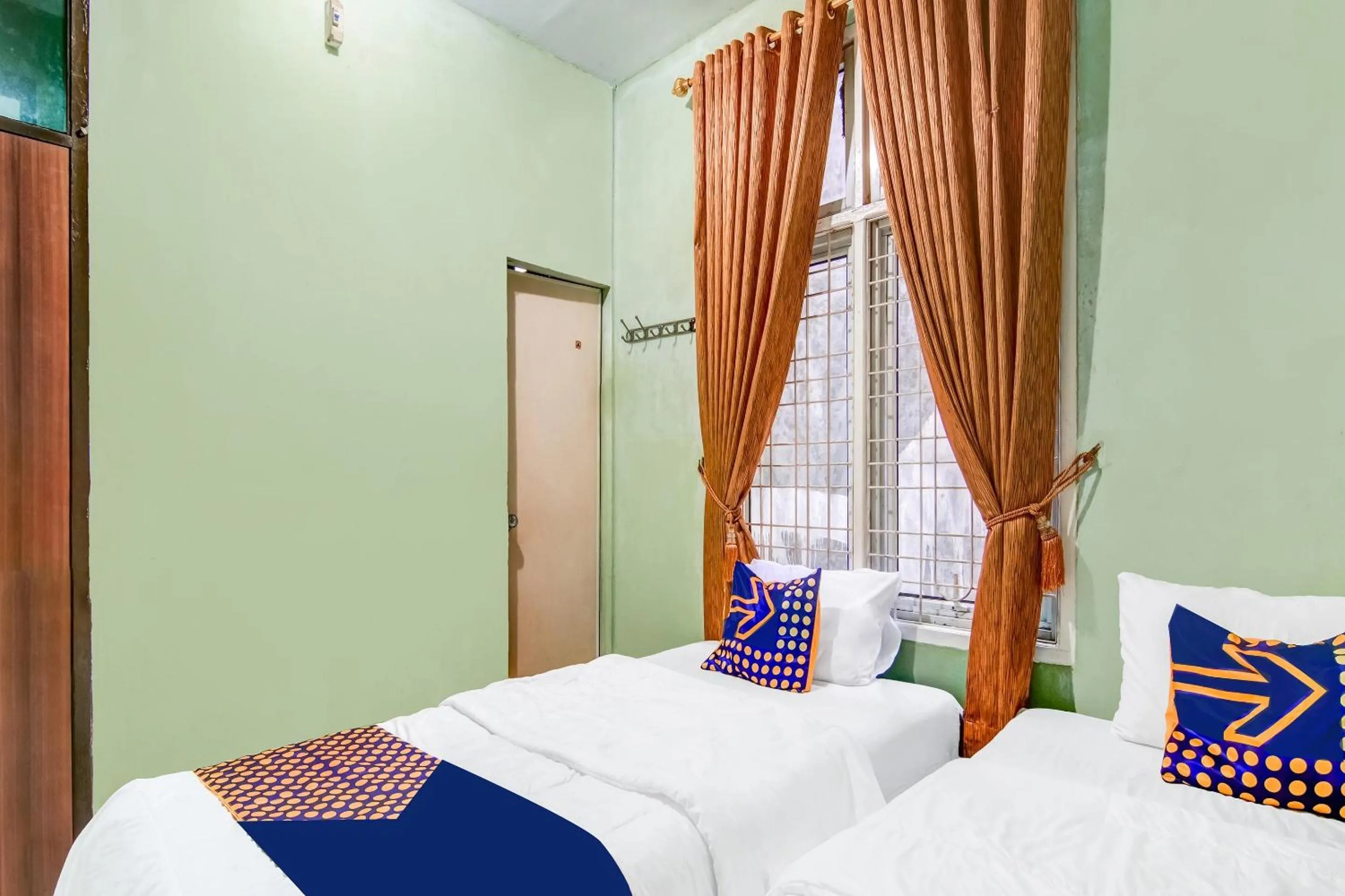 Bedroom in Hotel O Nayla Homestay Syariah Near Koro Koro Panam, Karaoke, Pool, & Cafe