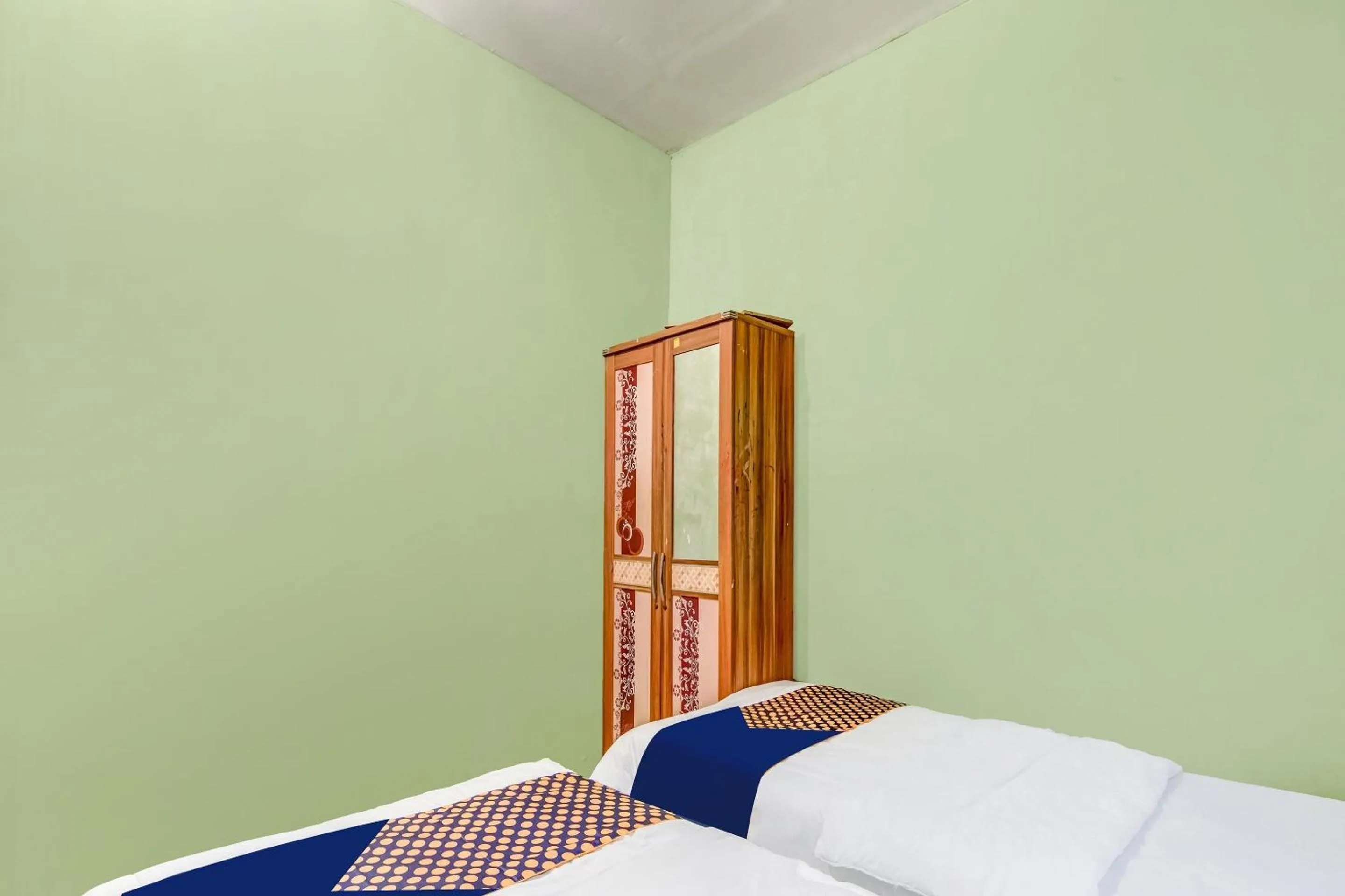 Bedroom in Hotel O Nayla Homestay Syariah Near Koro Koro Panam, Karaoke, Pool, & Cafe