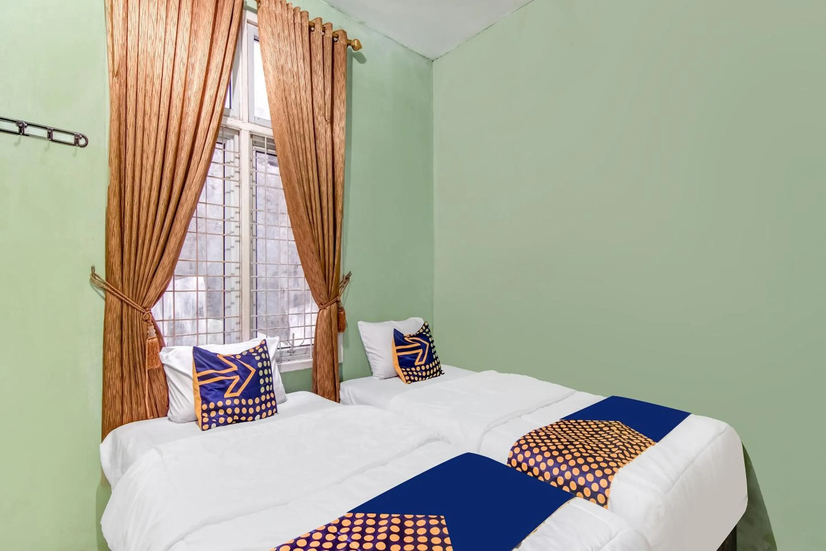 Bedroom in Hotel O Nayla Homestay Syariah Near Koro Koro Panam, Karaoke, Pool, & Cafe