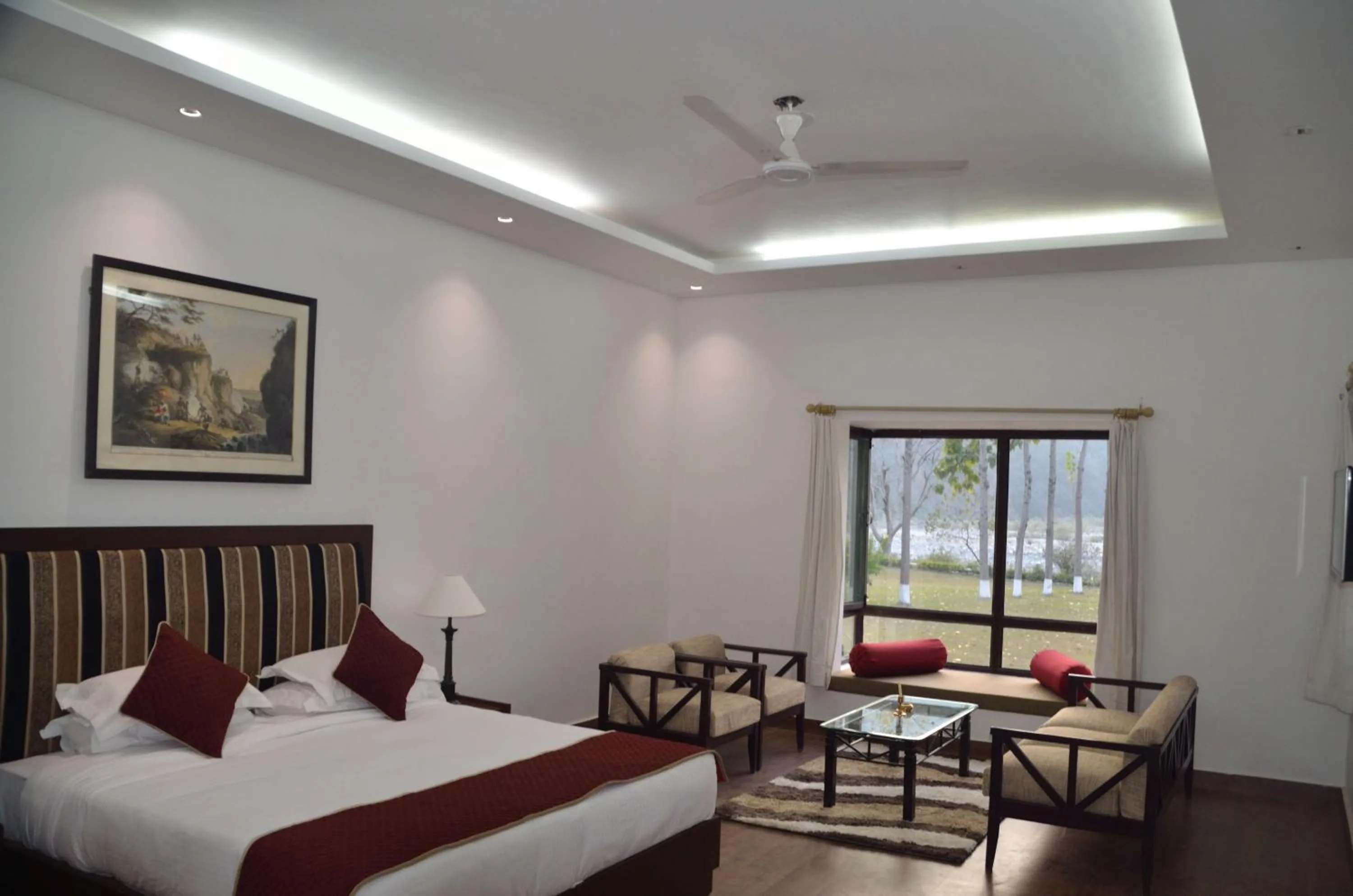 Bed in WelcomHeritage Tarangi Ramganga Resort