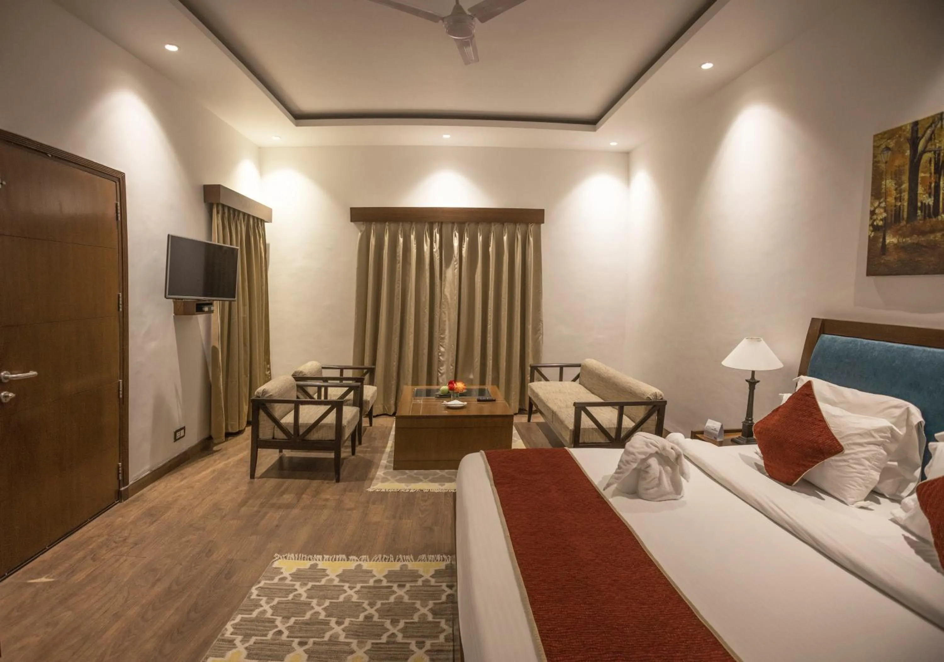 Bed in WelcomHeritage Tarangi Ramganga Resort