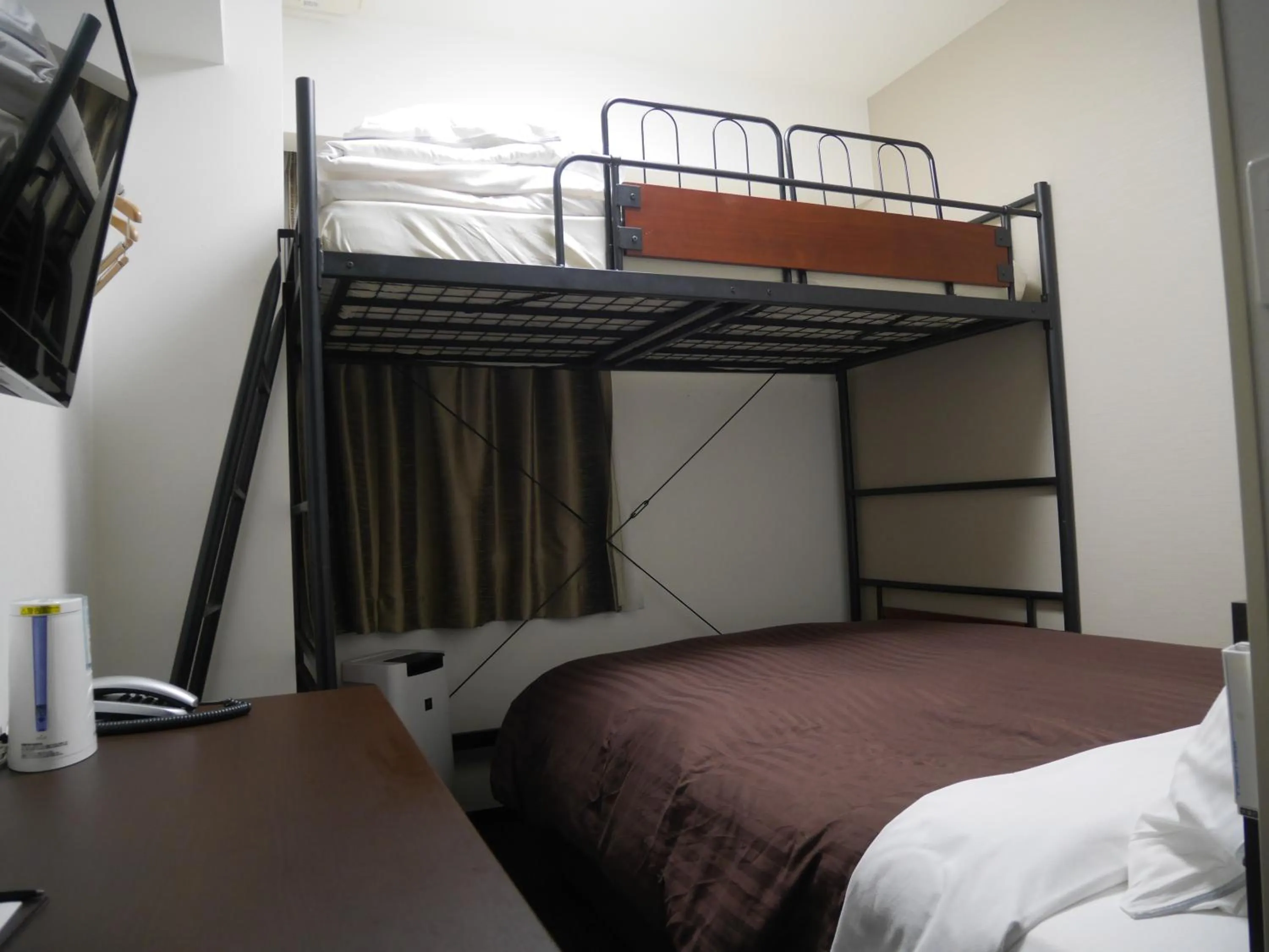 Bed in HOTEL GLAN Y's KUMAGAYAEKIMAE premier