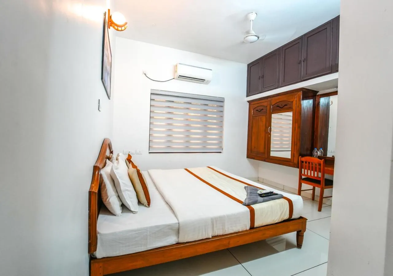 towels, Bed in Pop Tavern Kovalam Beach Villa by VOYE HOMES