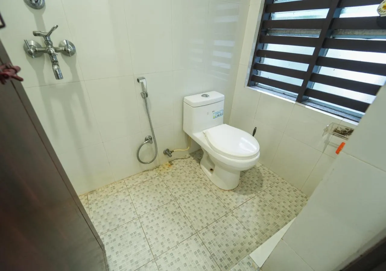 Toilet in Pop Tavern Kovalam Beach Villa by VOYE HOMES