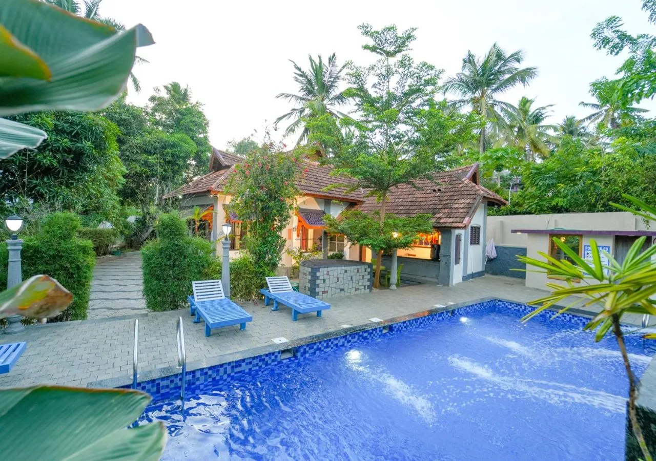 Swimming pool in Pop Tavern Kovalam Beach Villa by VOYE HOMES