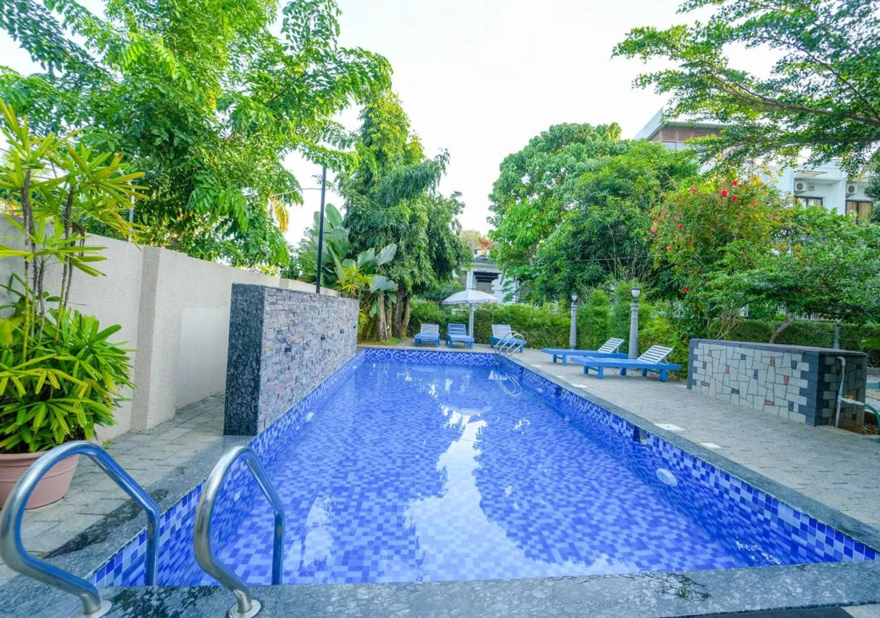 Swimming pool in Pop Tavern Kovalam Beach Villa by VOYE HOMES