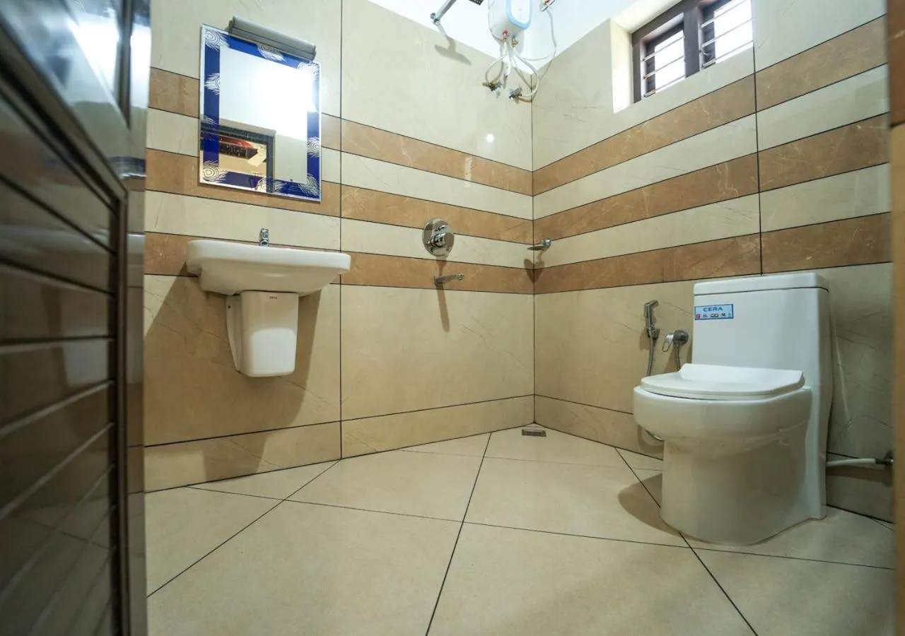 Bathroom in Pop Tavern Kovalam Beach Villa by VOYE HOMES