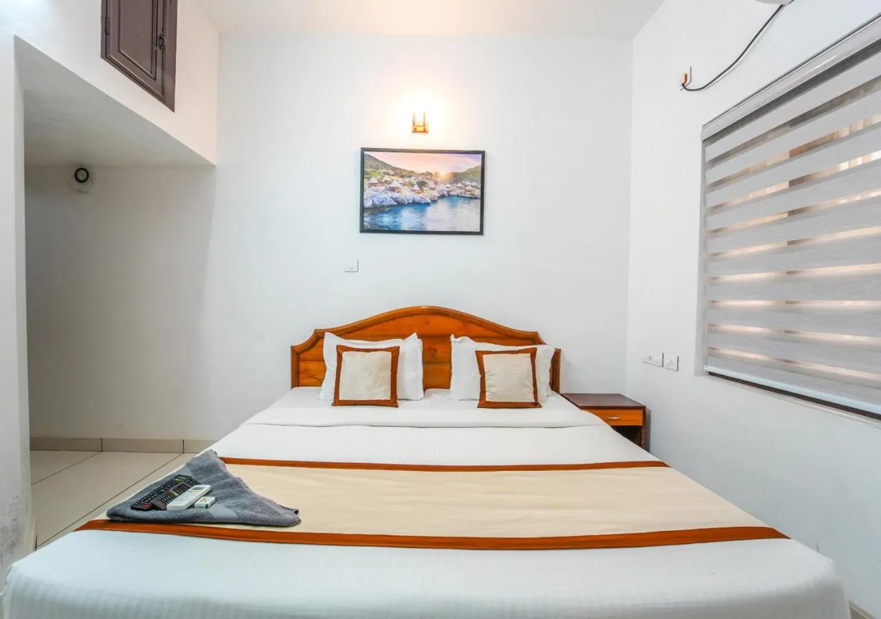 Photo of the whole room, Bed in Pop Tavern Kovalam Beach Villa by VOYE HOMES