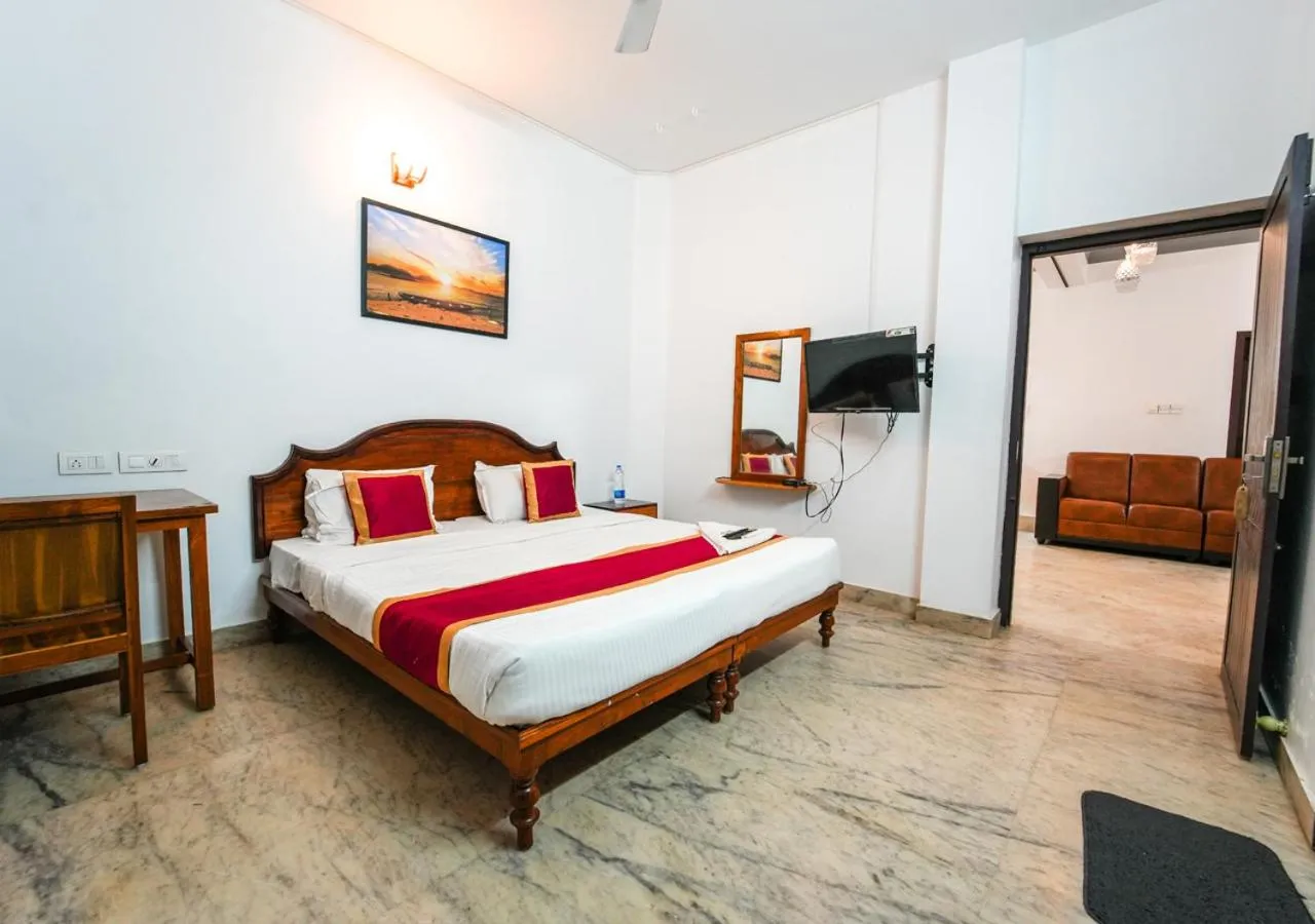 Bed in Pop Tavern Kovalam Beach Villa by VOYE HOMES