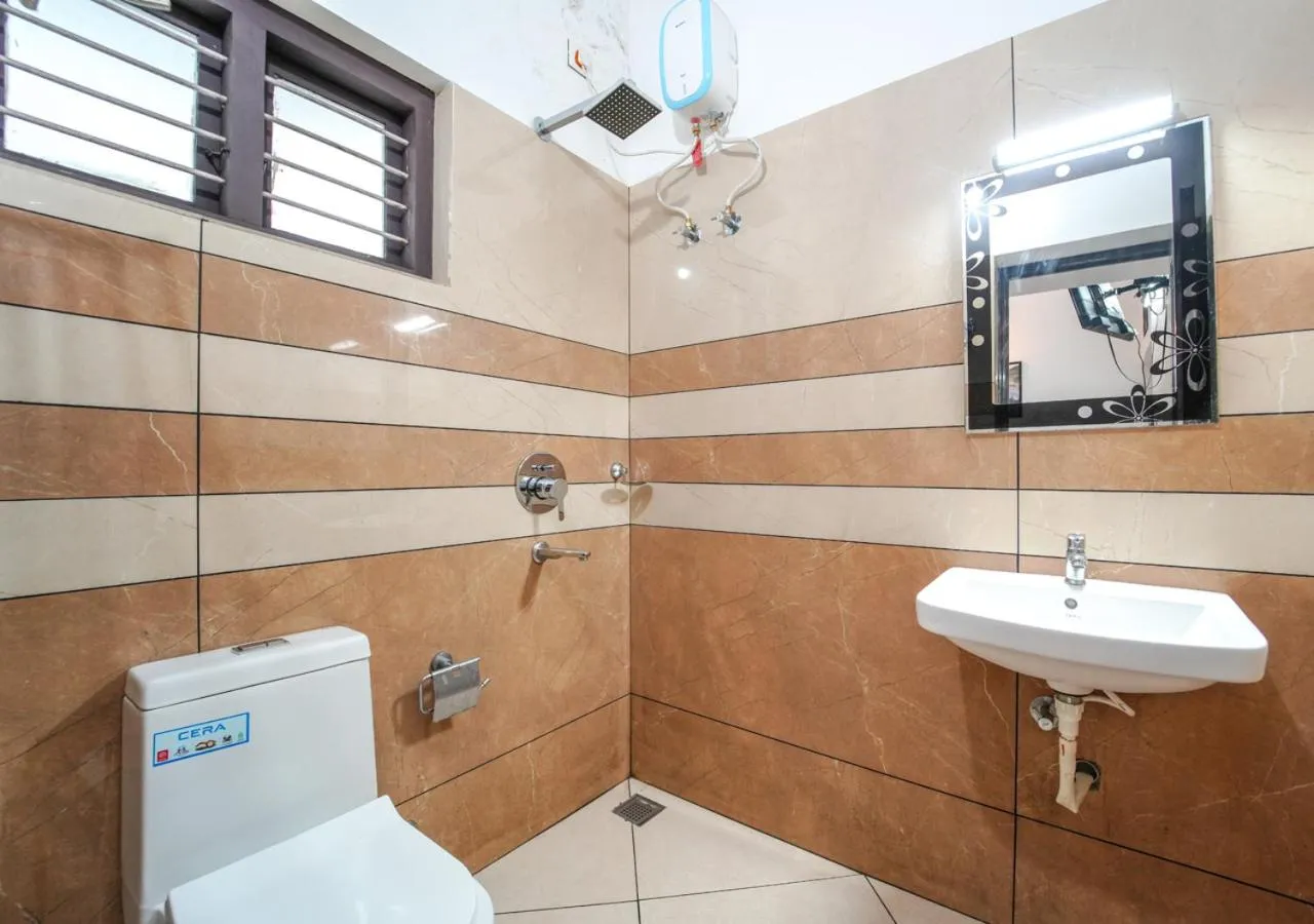Shower in Pop Tavern Kovalam Beach Villa by VOYE HOMES