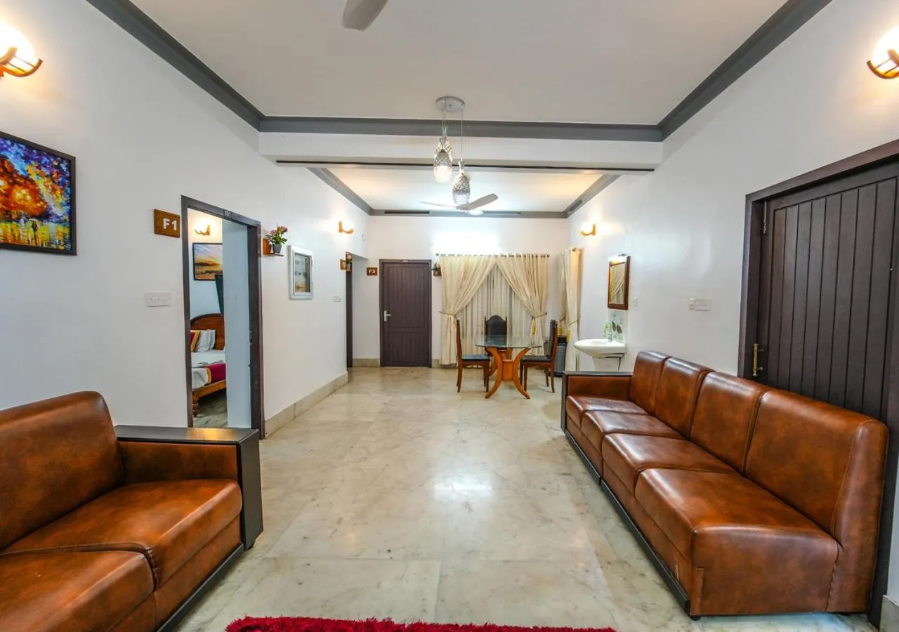 Living room in Pop Tavern Kovalam Beach Villa by VOYE HOMES