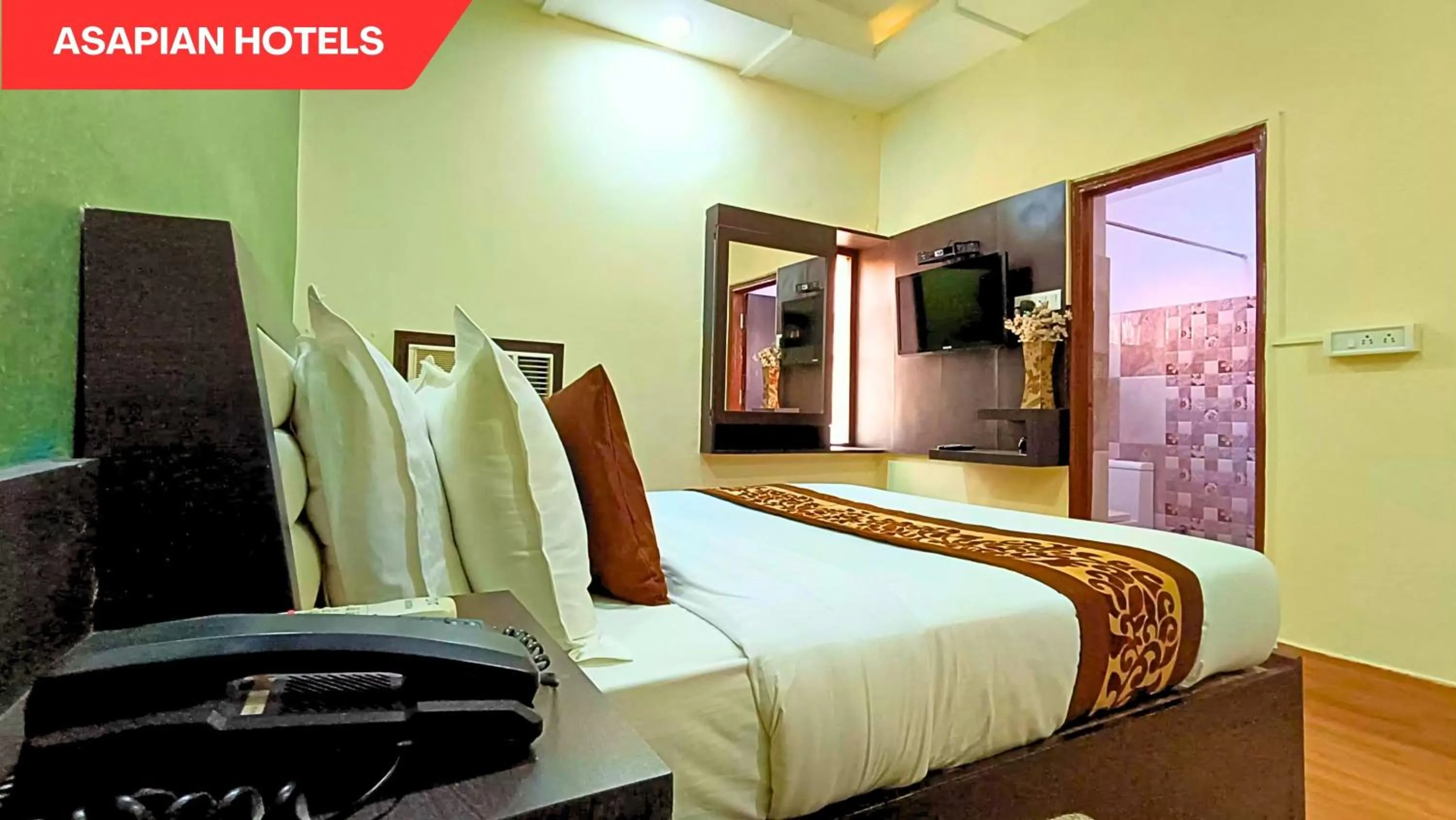 Bed in Hotel Vijay Deluxe