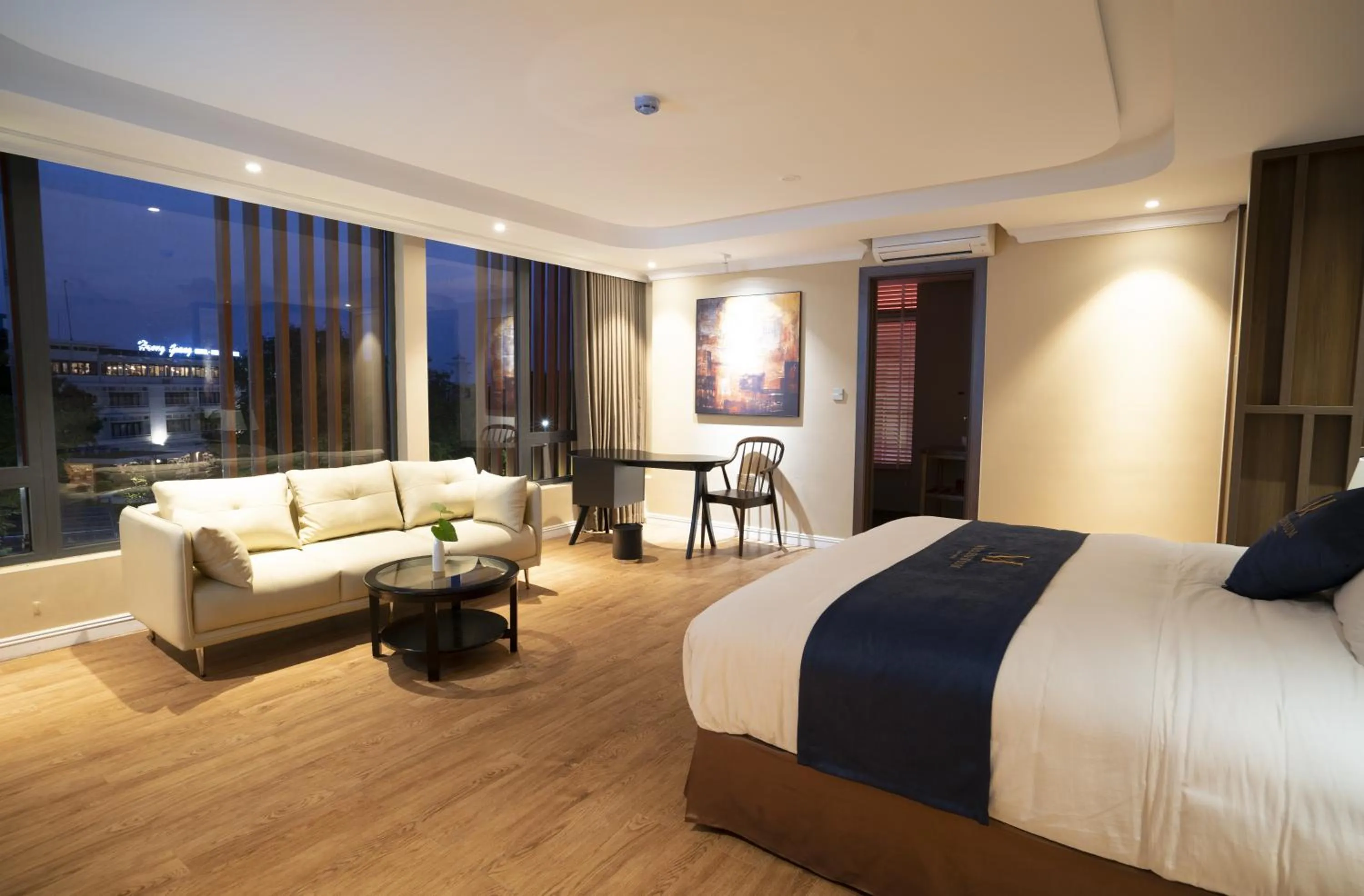 Living room, Bed in Millennium Hue Hotel