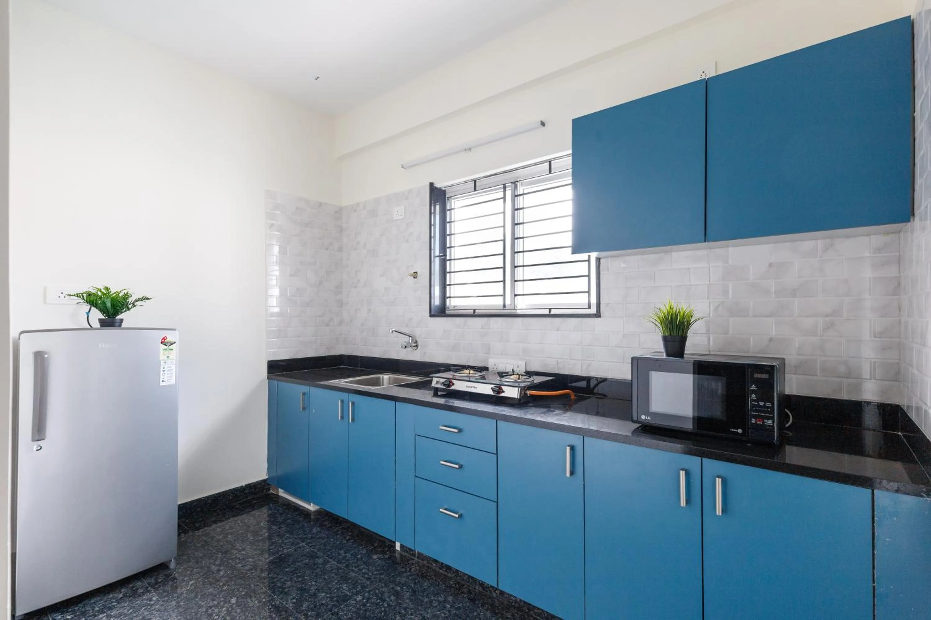 Kitchen or kitchenette in SPLENDID SHUBHAM SERVICED APARTMENTS