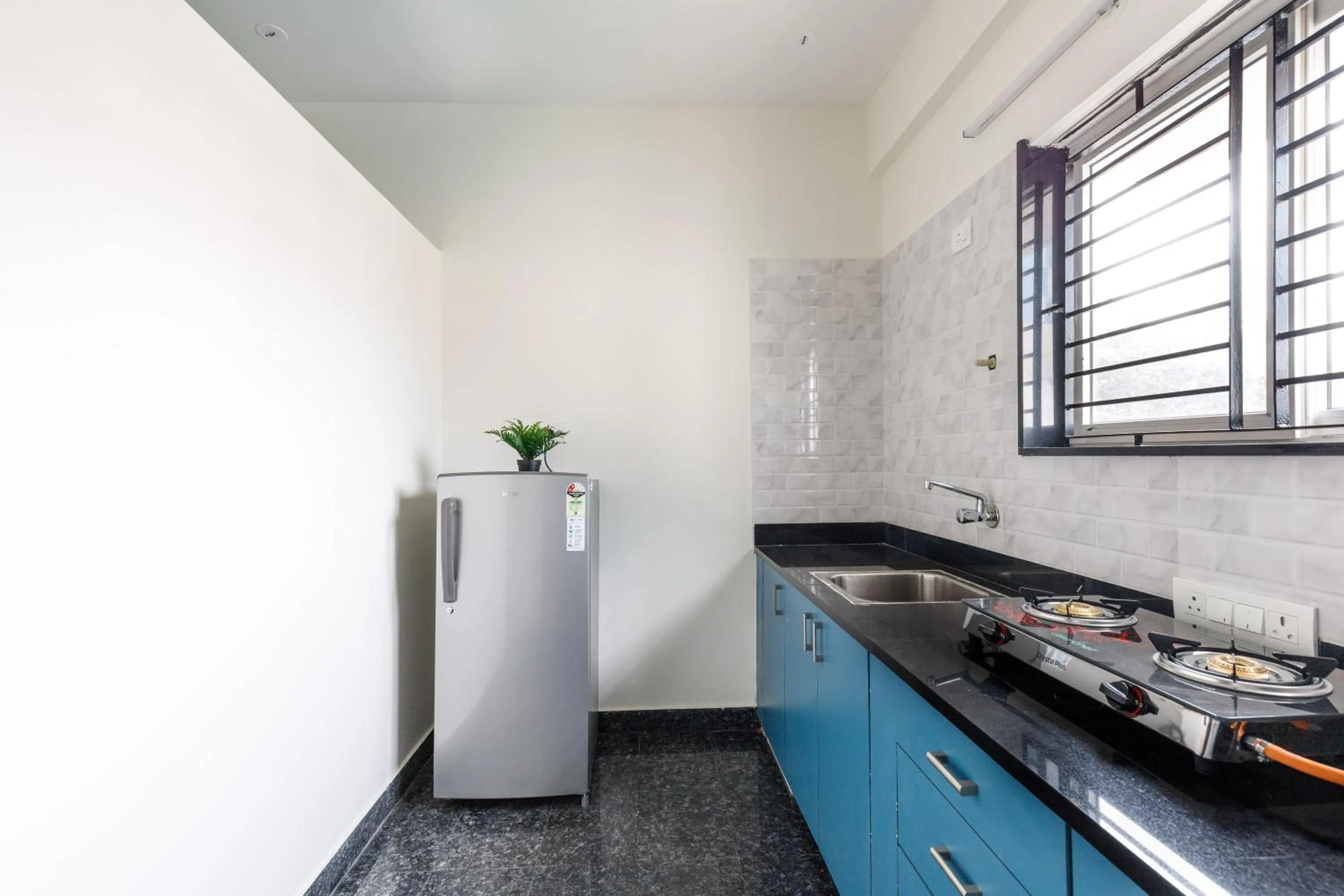 Kitchen or kitchenette in SPLENDID SHUBHAM SERVICED APARTMENTS